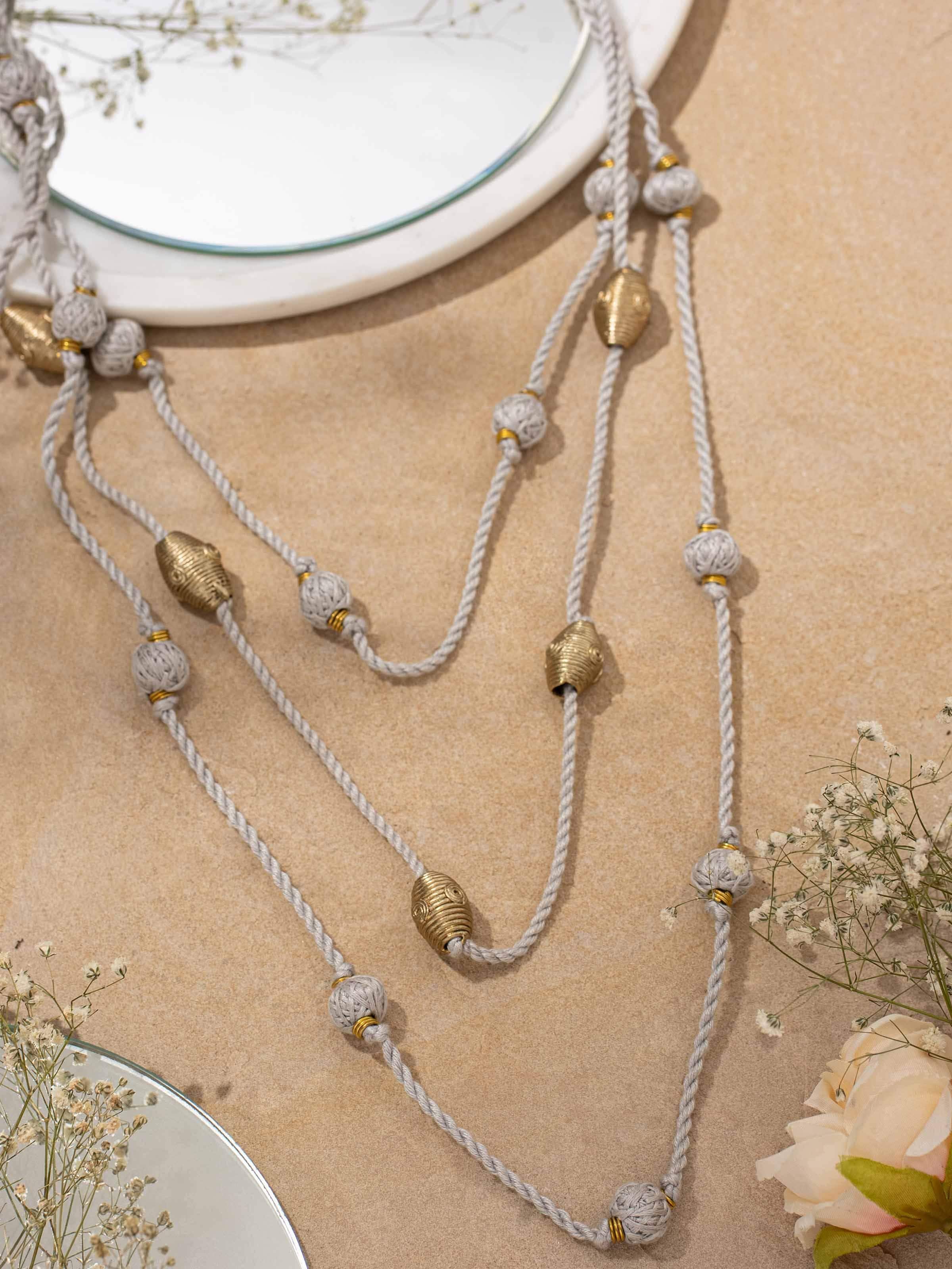 Side view of Dhokra long necklace highlighting detailed work