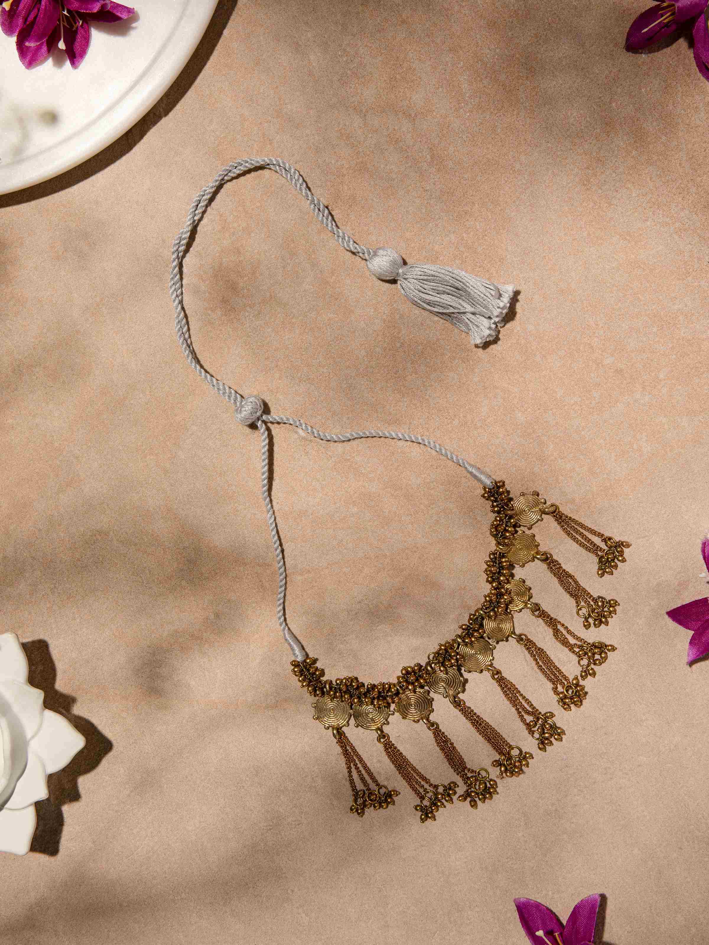 Side view of Dhokra Collar Necklace highlighting the unique collar design and intricate metal detailing.