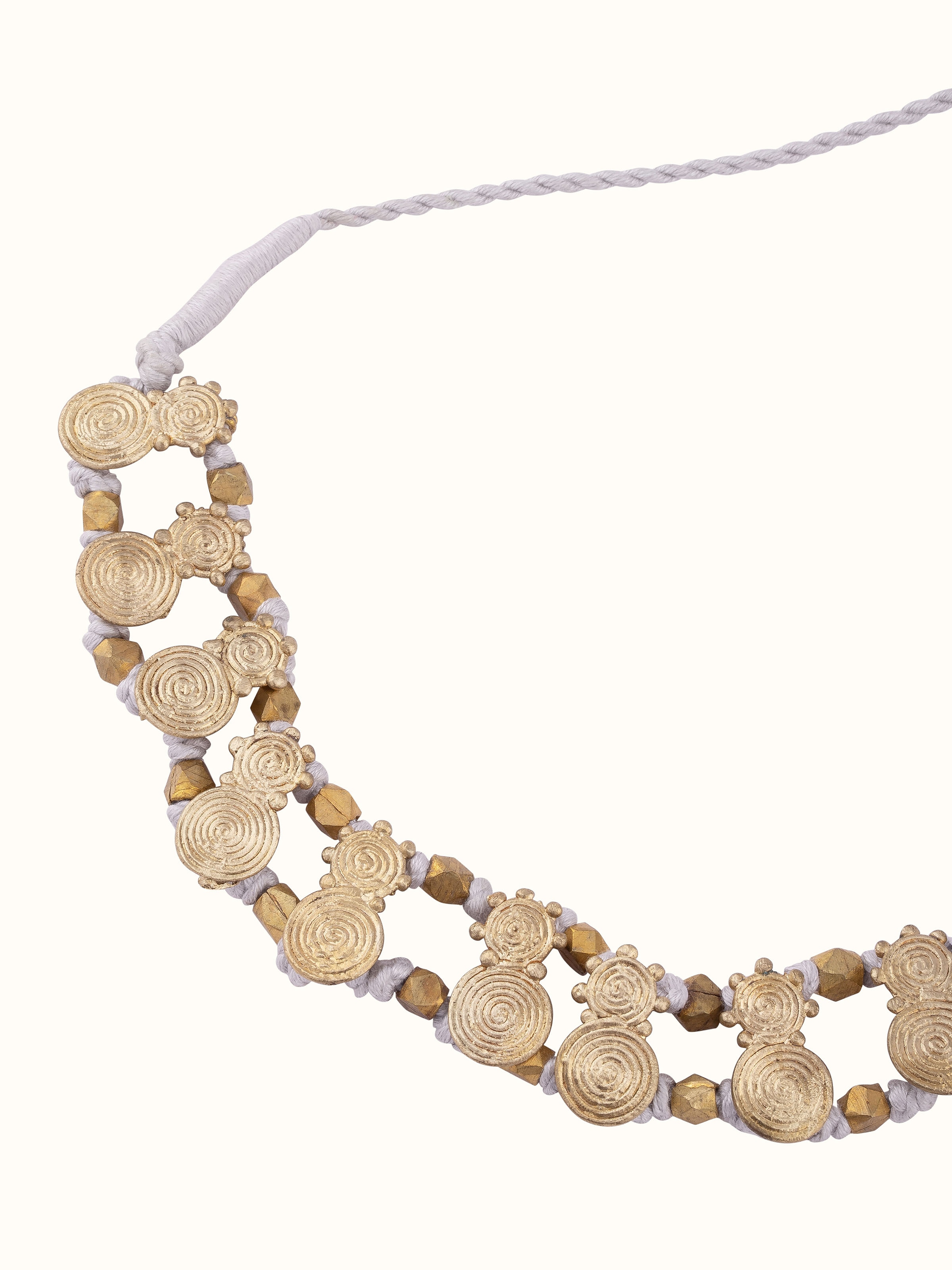 Angled view of Dhokra Choker showcasing its ornate design and exquisite metal detailing.