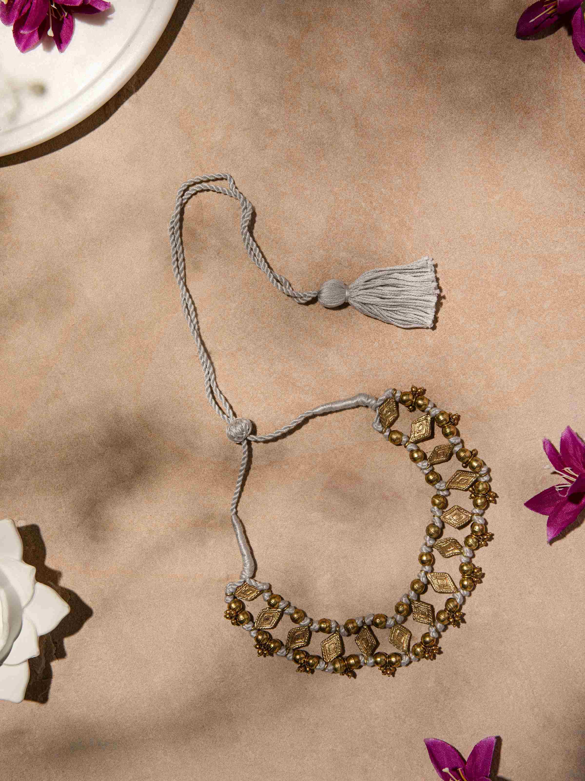 Side view of Dhokra Choker Earrings showing the detailed craftsmanship and traditional design.