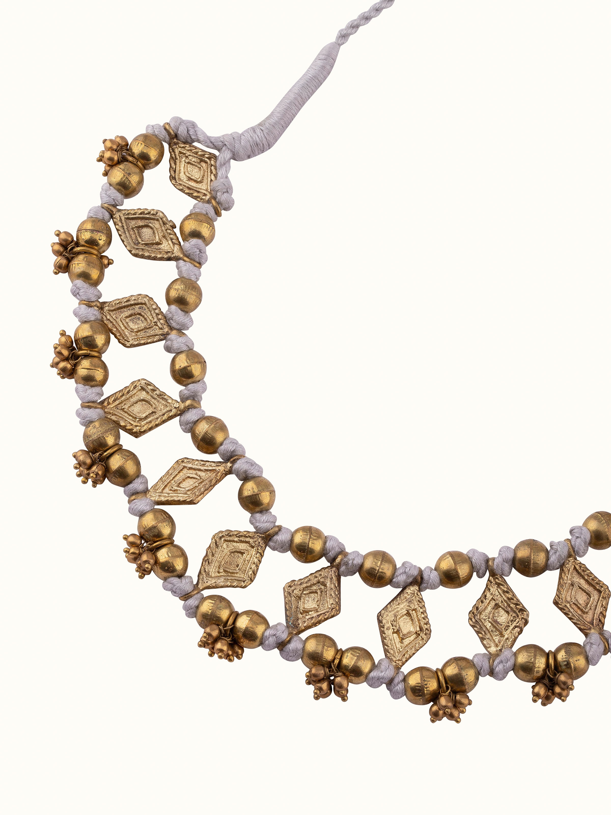 Back view of Dhokra Choker Earrings featuring the secure fastening and artisanal metal work.