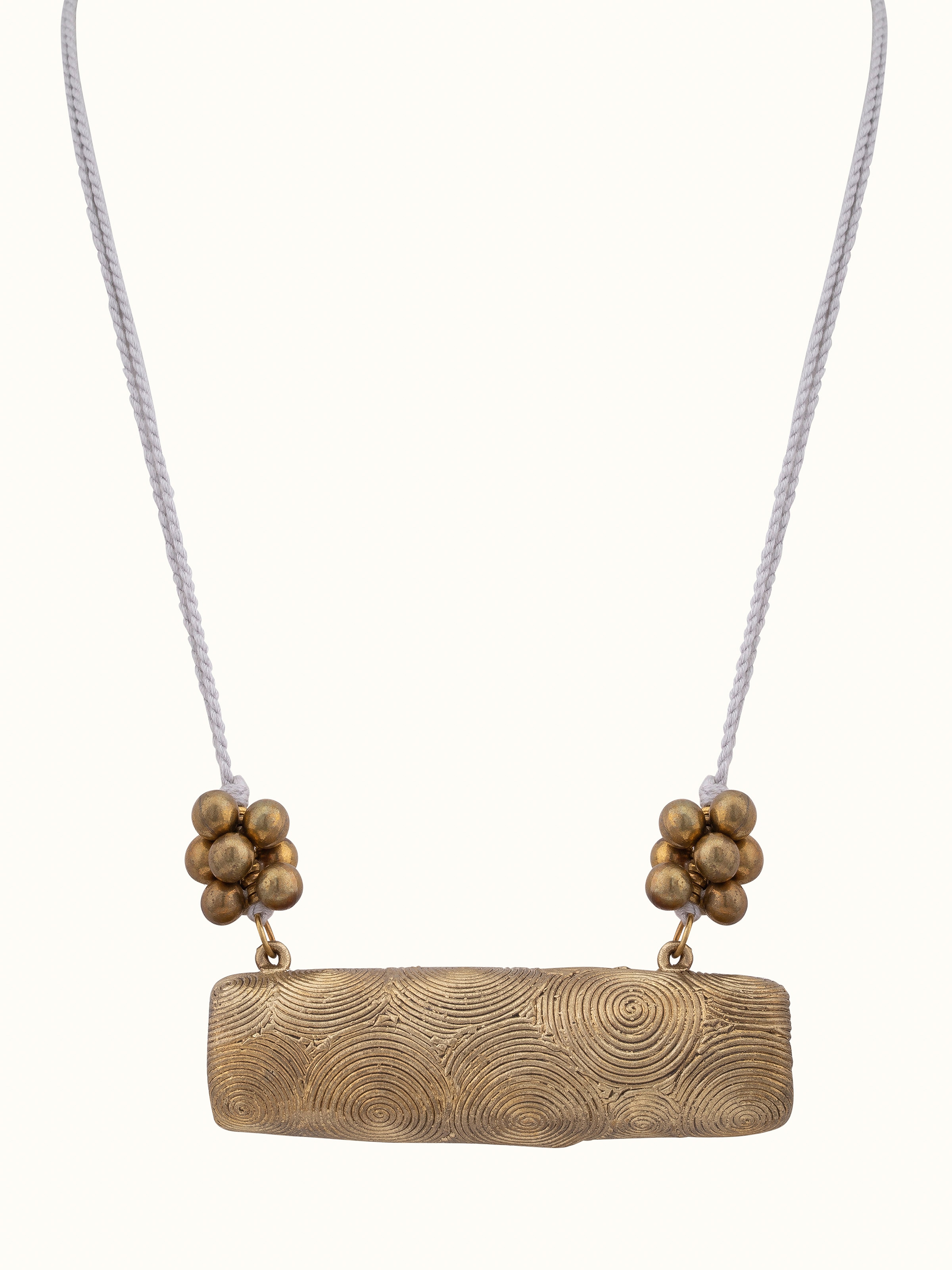 Front view of Dhokra long necklace highlighting intricate tribal designs.