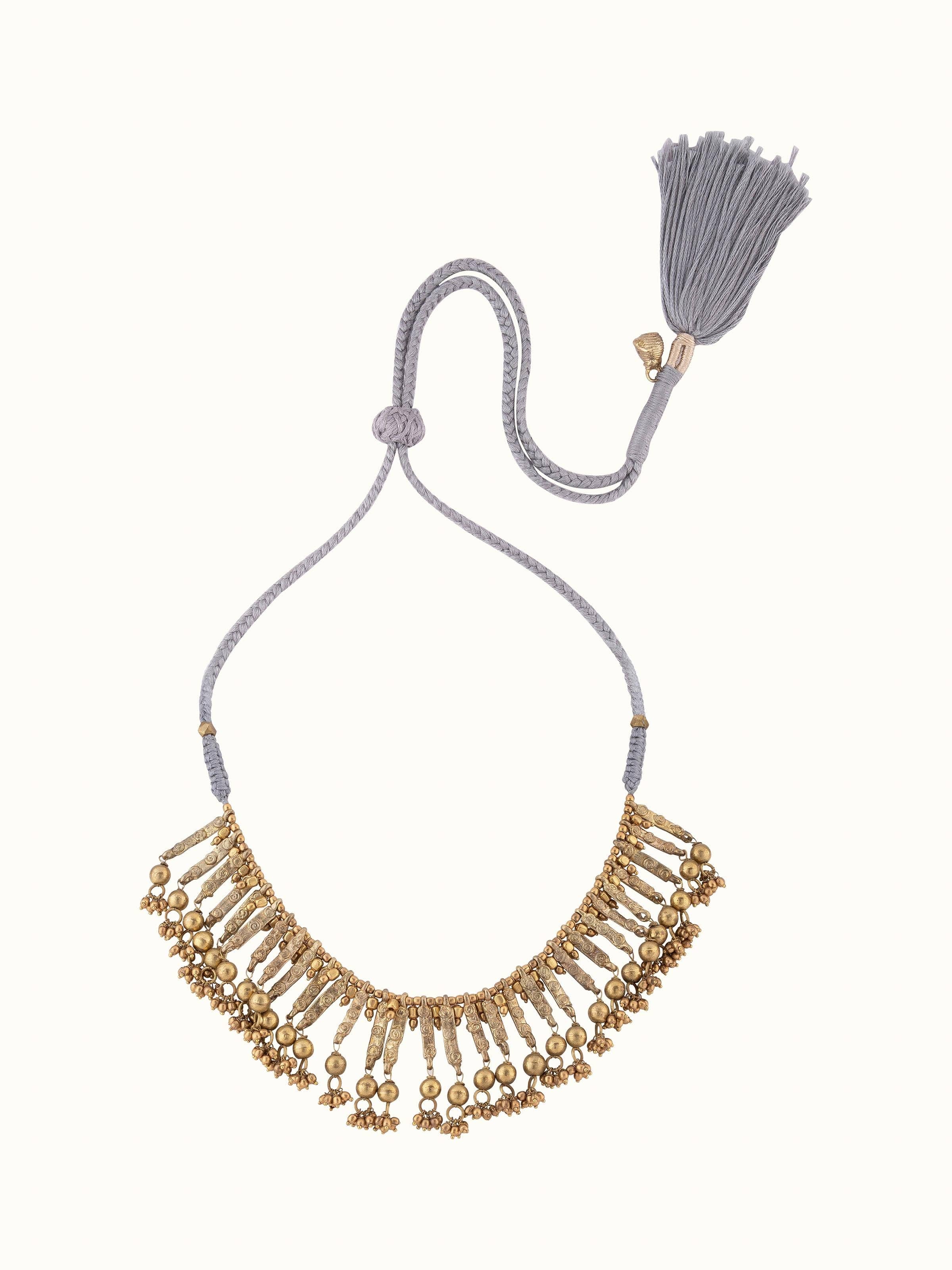 Detailed view of Dhokra choker's traditional design and artisanal craftsmanship.