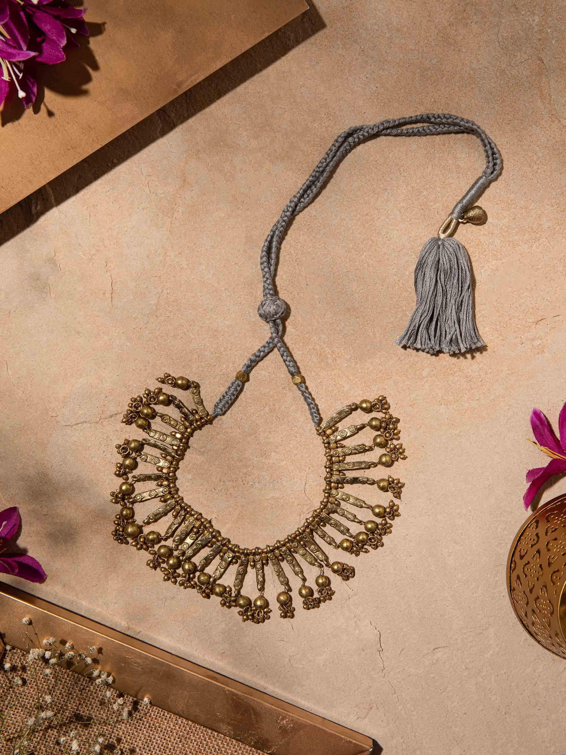 Close-up of Dhokra choker revealing traditional tribal design elements and intricate detailing.