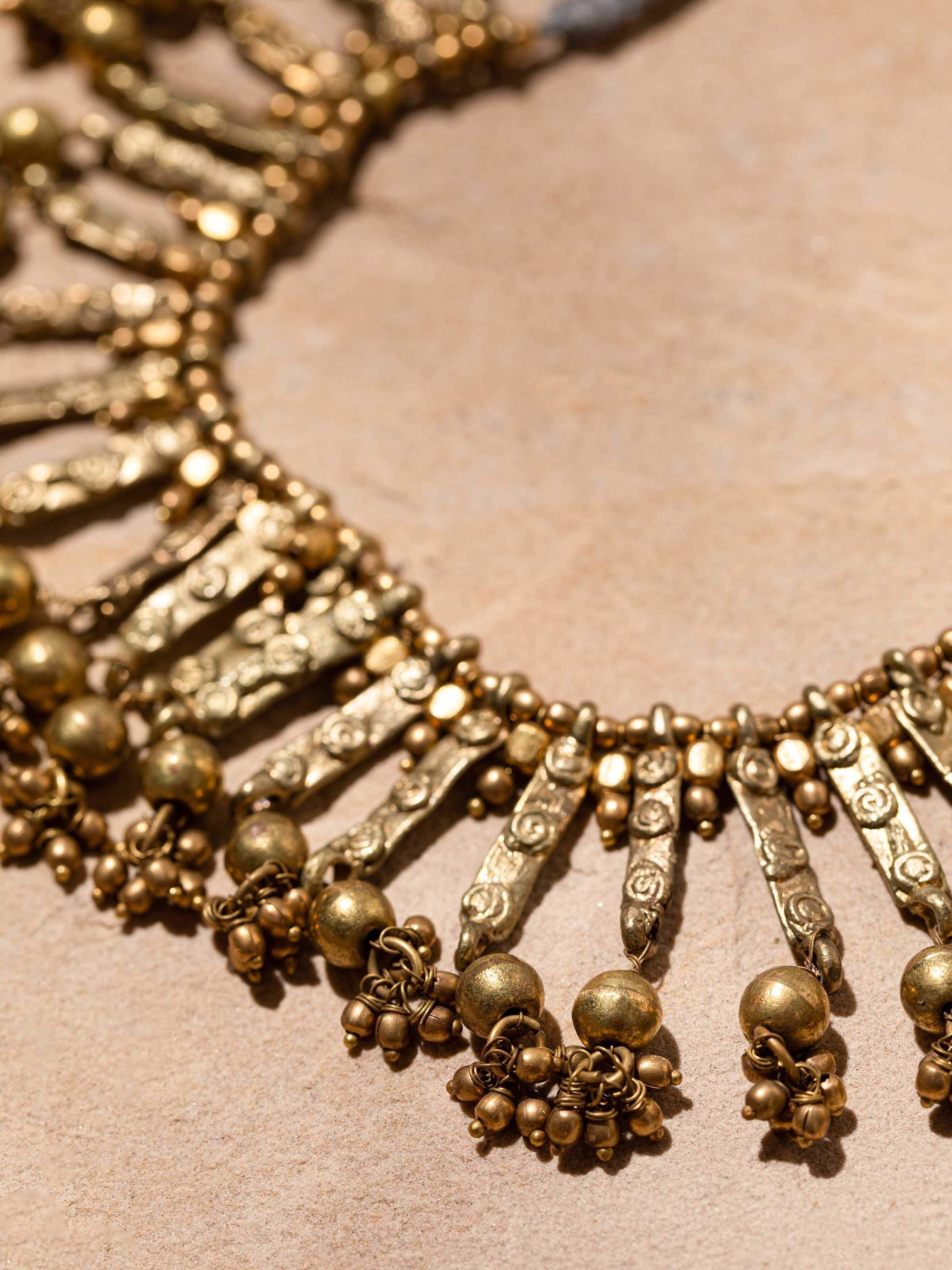 Side view of Dhokra choker showcasing detailed tribal motifs and unique craftsmanship.
