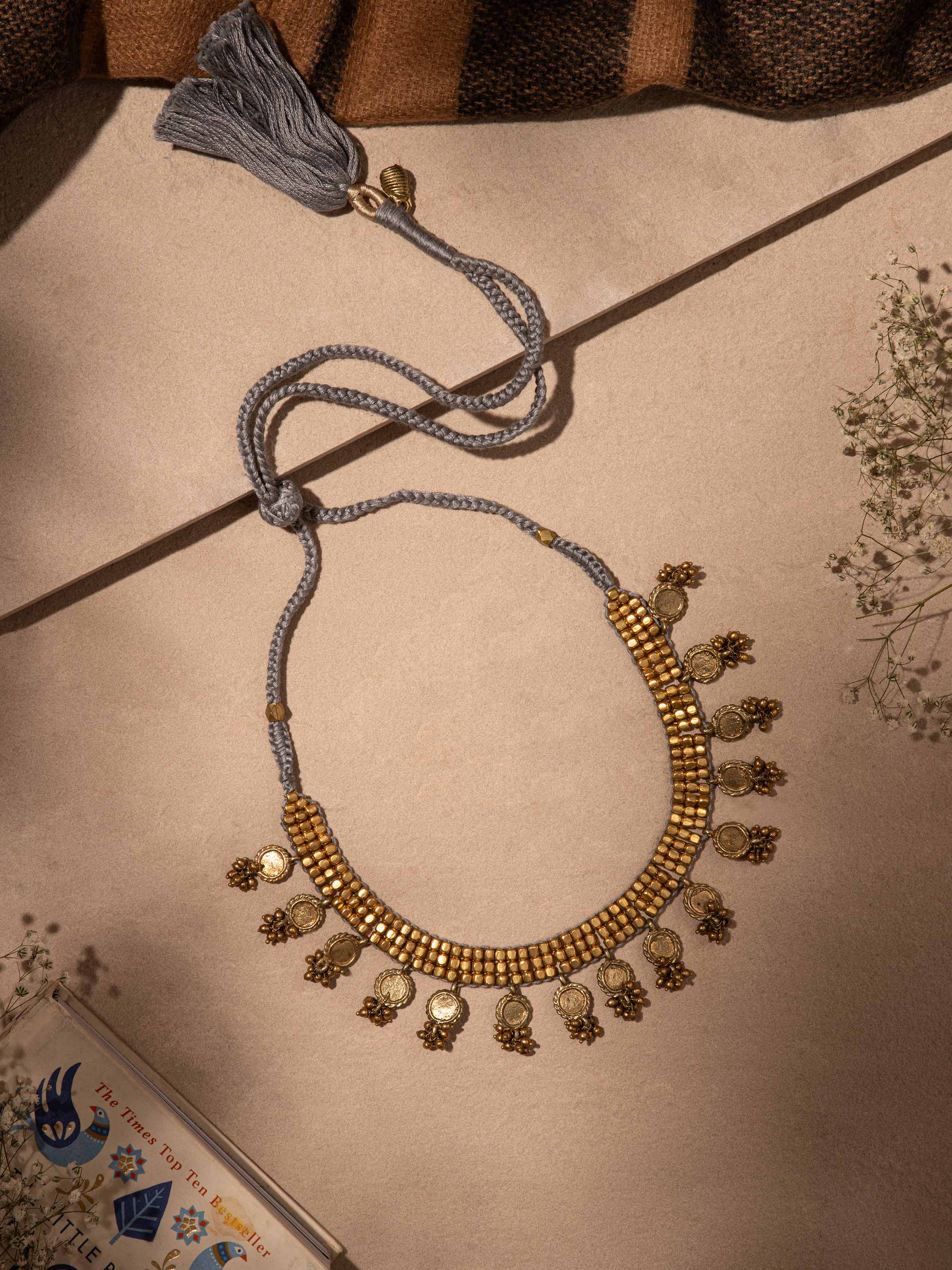 Side view of Dhokra choker highlighting elegant craftsmanship and traditional motifs
