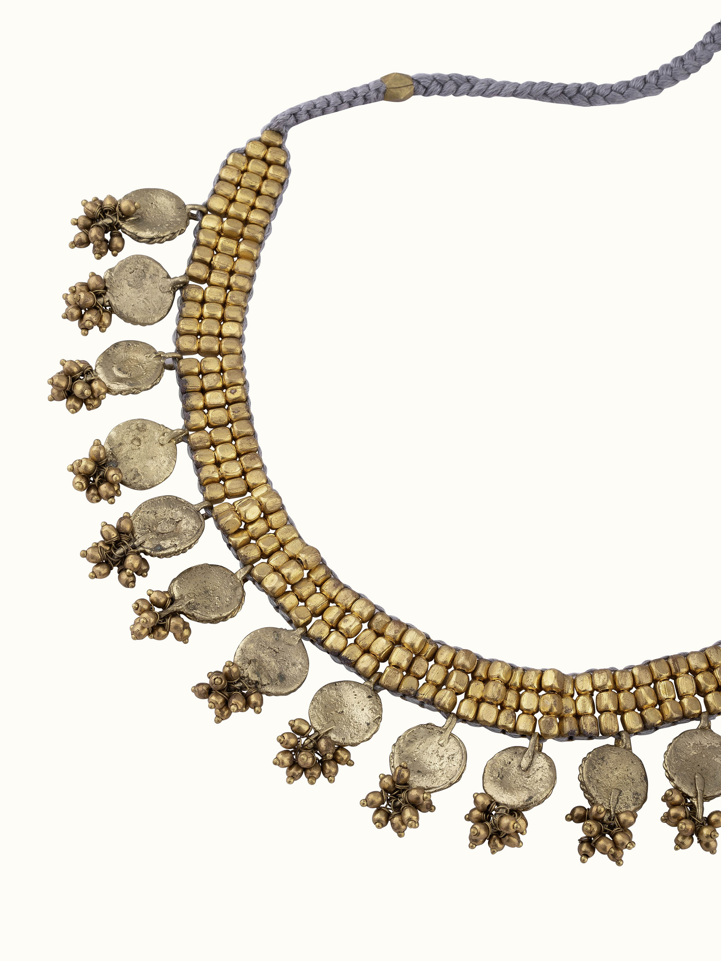 Overhead view of Dhokra choker displaying traditional tribal patterns and unique design