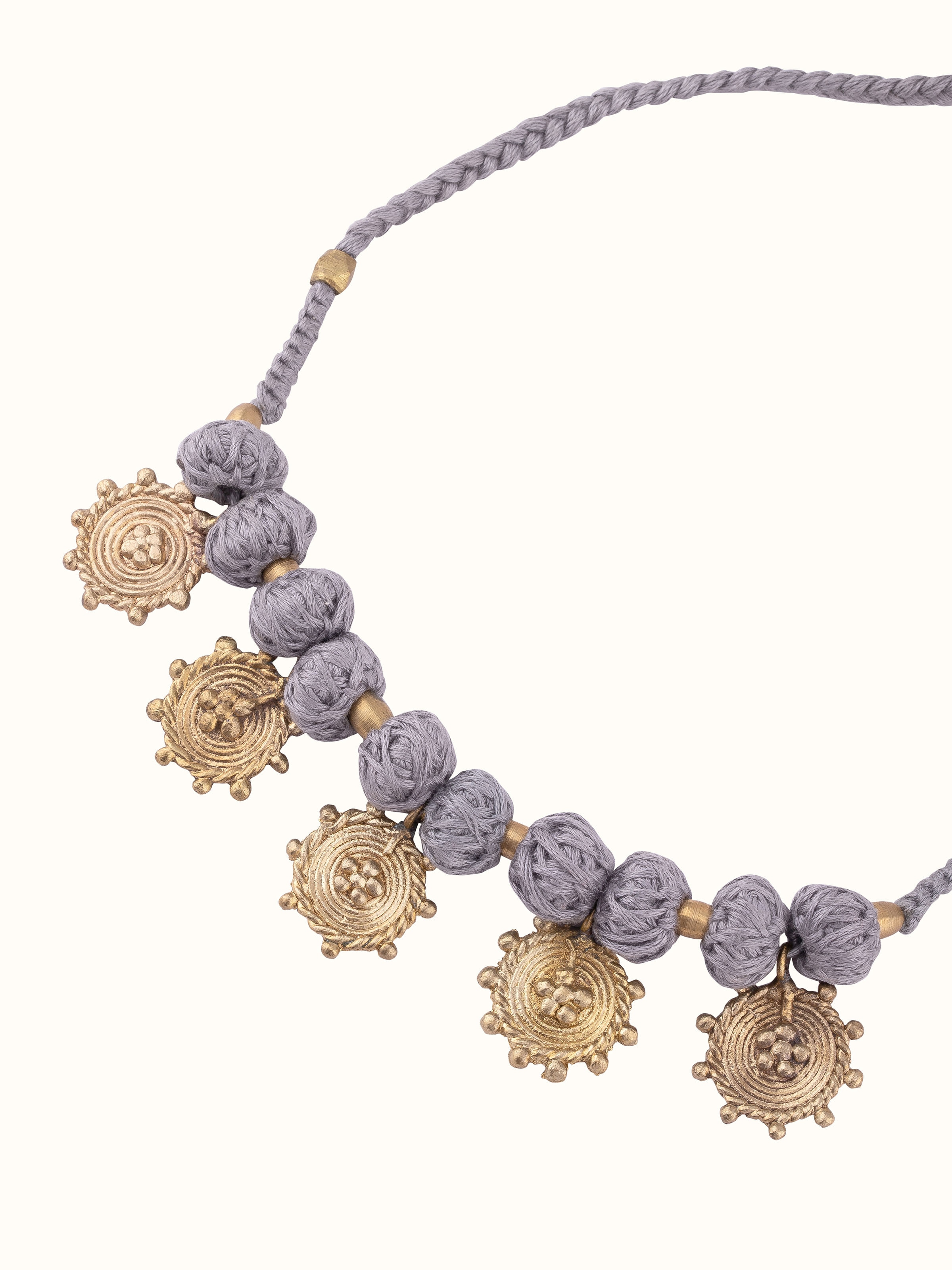 Angled view of Dhokra Choker to highlight its unique design and metalwork.