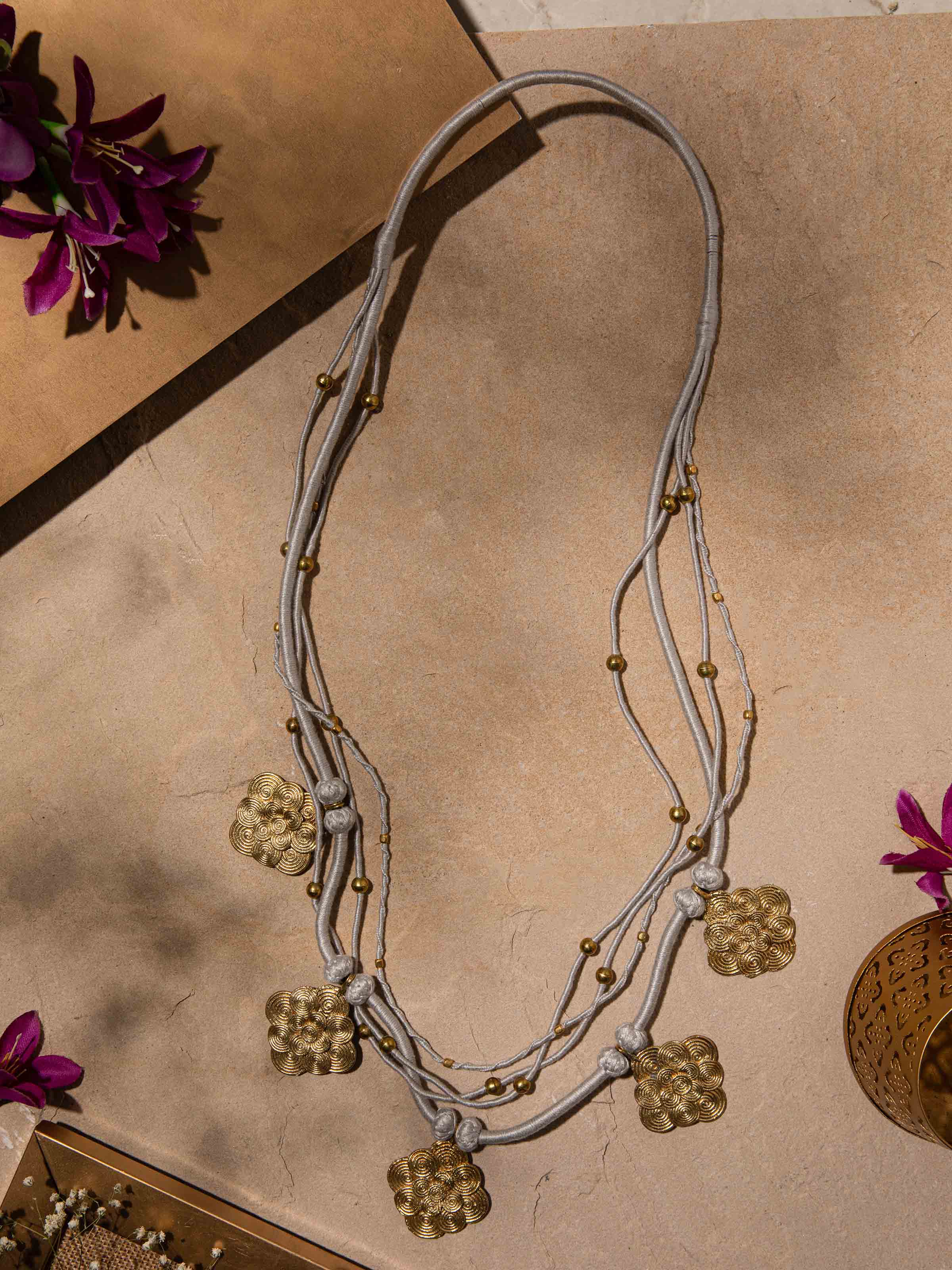 Side view of Dhokra Long Necklace illustrating the elegant design and detailed craftsmanship.