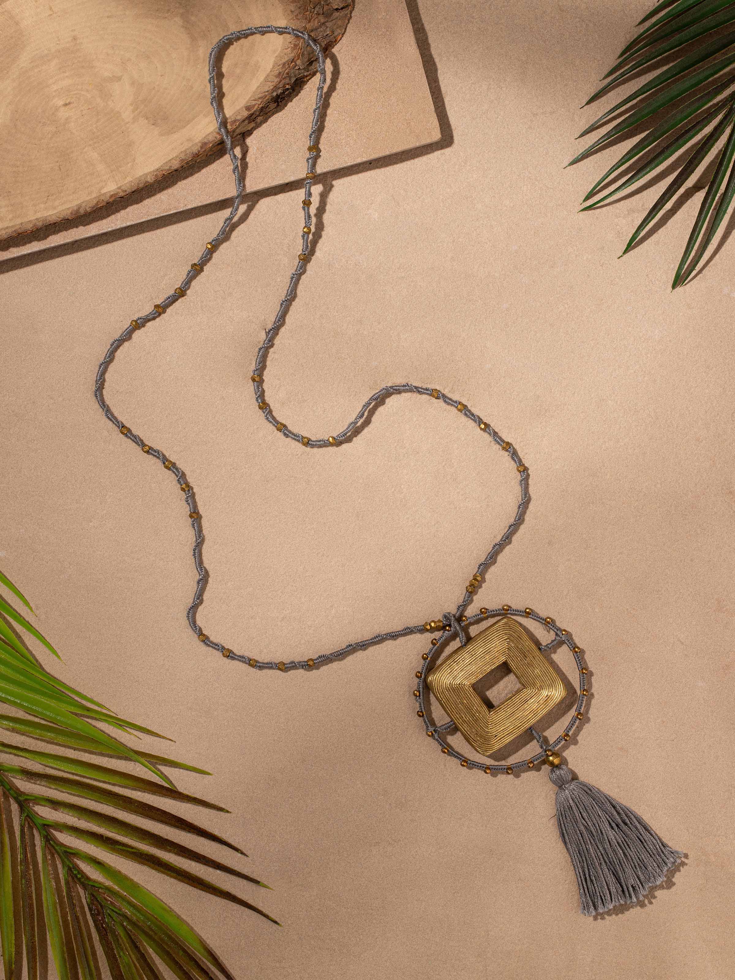 Side view of Dhokra Pendant & Chain highlighting the elegant design and quality of the pendant.