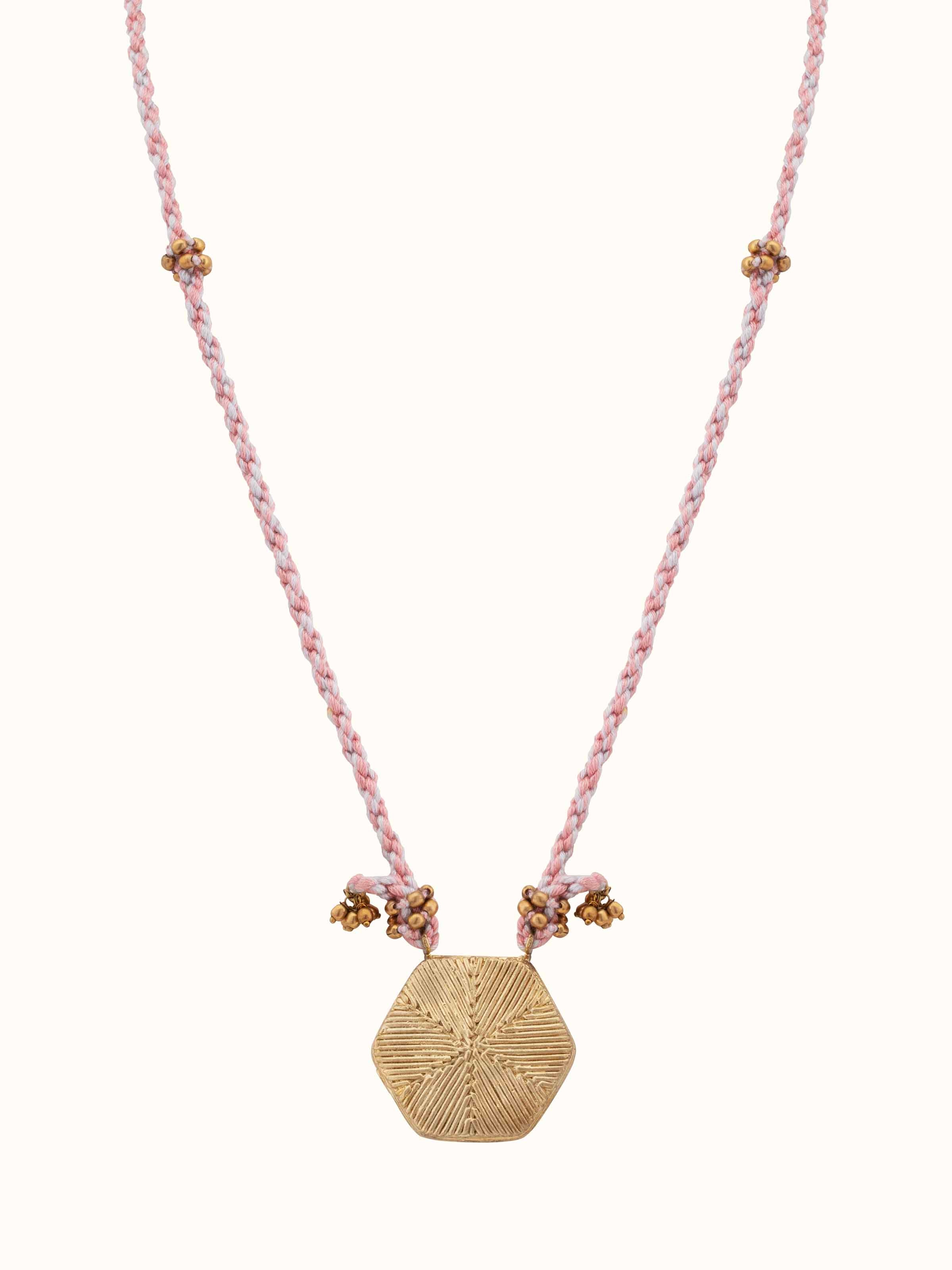 Front view of Dhokra pendant and chain featuring intricate metalwork and traditional design.