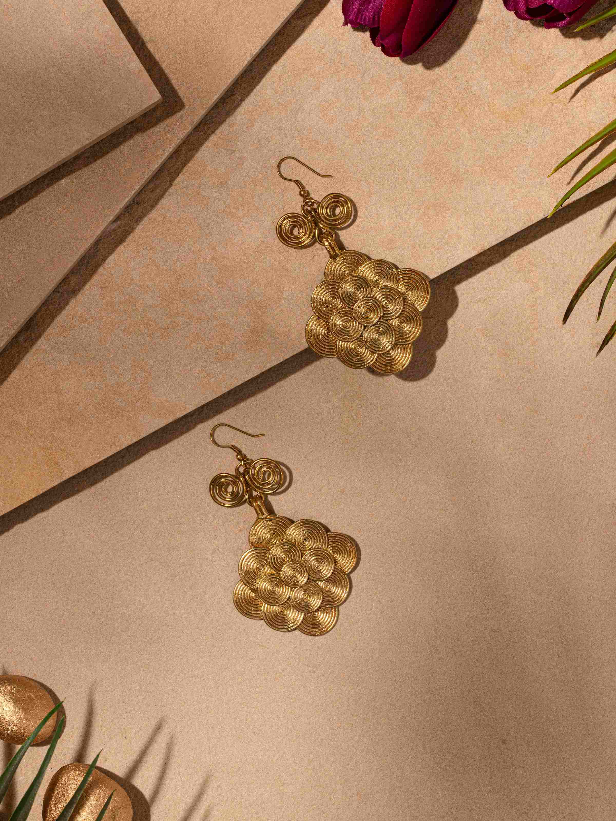Close-up view of Dhokra Drop Earrings showcasing intricate patterns and handcrafted details.