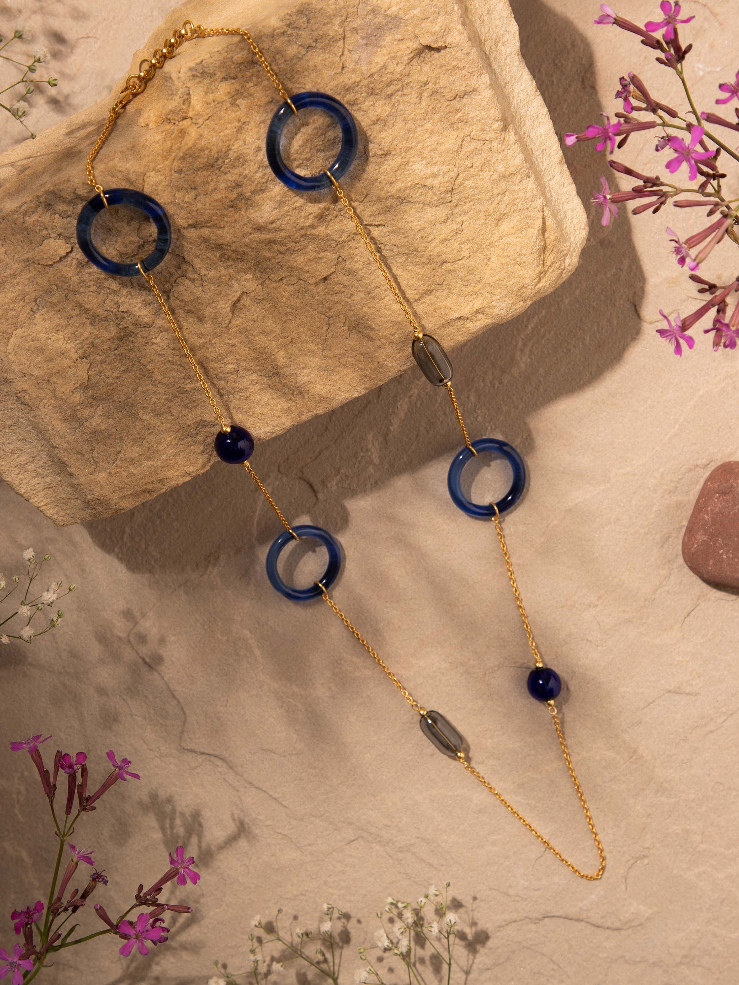 Side view of Silver Flame Glass Long Necklace highlighting its distinctive glass elements.