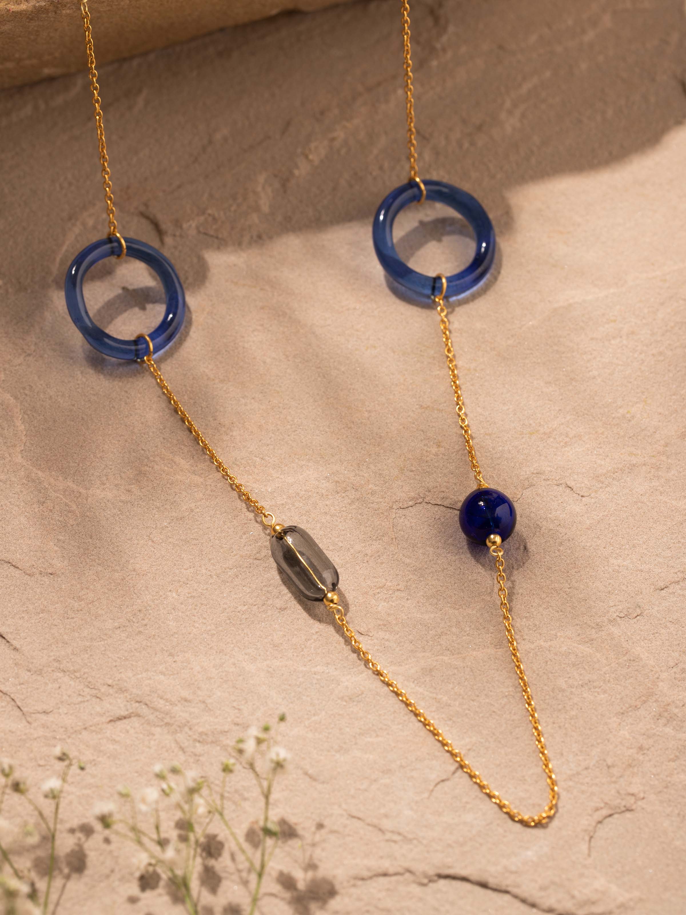 Detailed view of Silver Flame Glass Long Necklace from a distance showcasing its overall design.