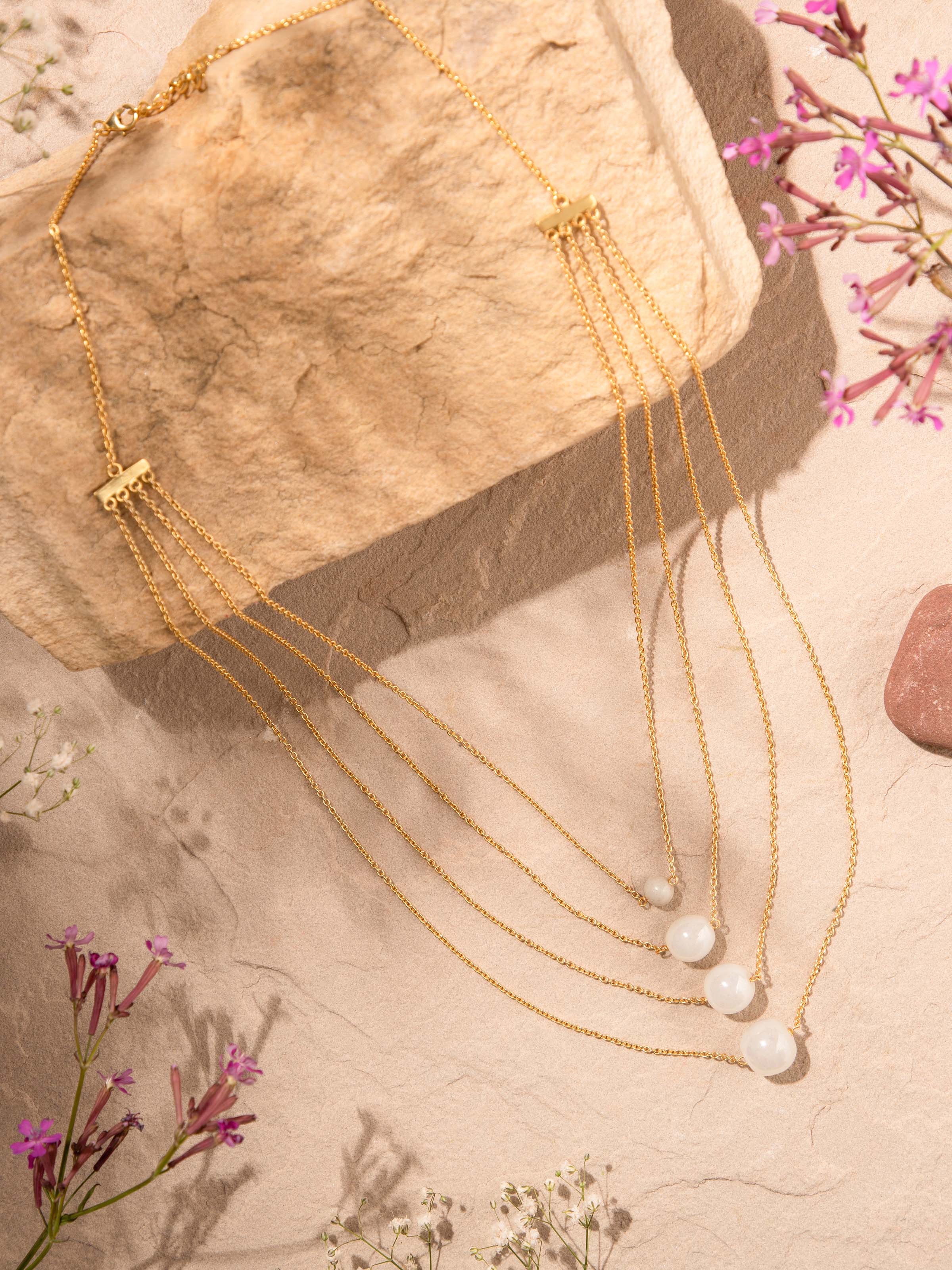 Side view of Silver Flame Glass Long Necklace showcasing the elegant glass and silver design by Swadesh