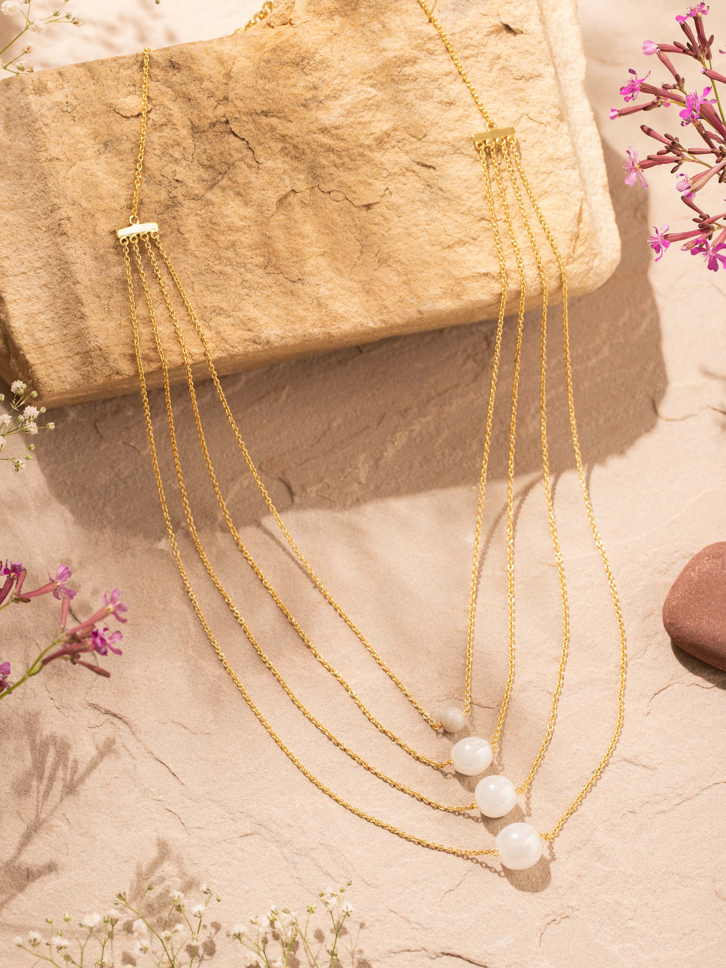 Angled view of Silver Flame Glass Long Necklace highlighting the vibrant glass elements and silver details by Swadesh