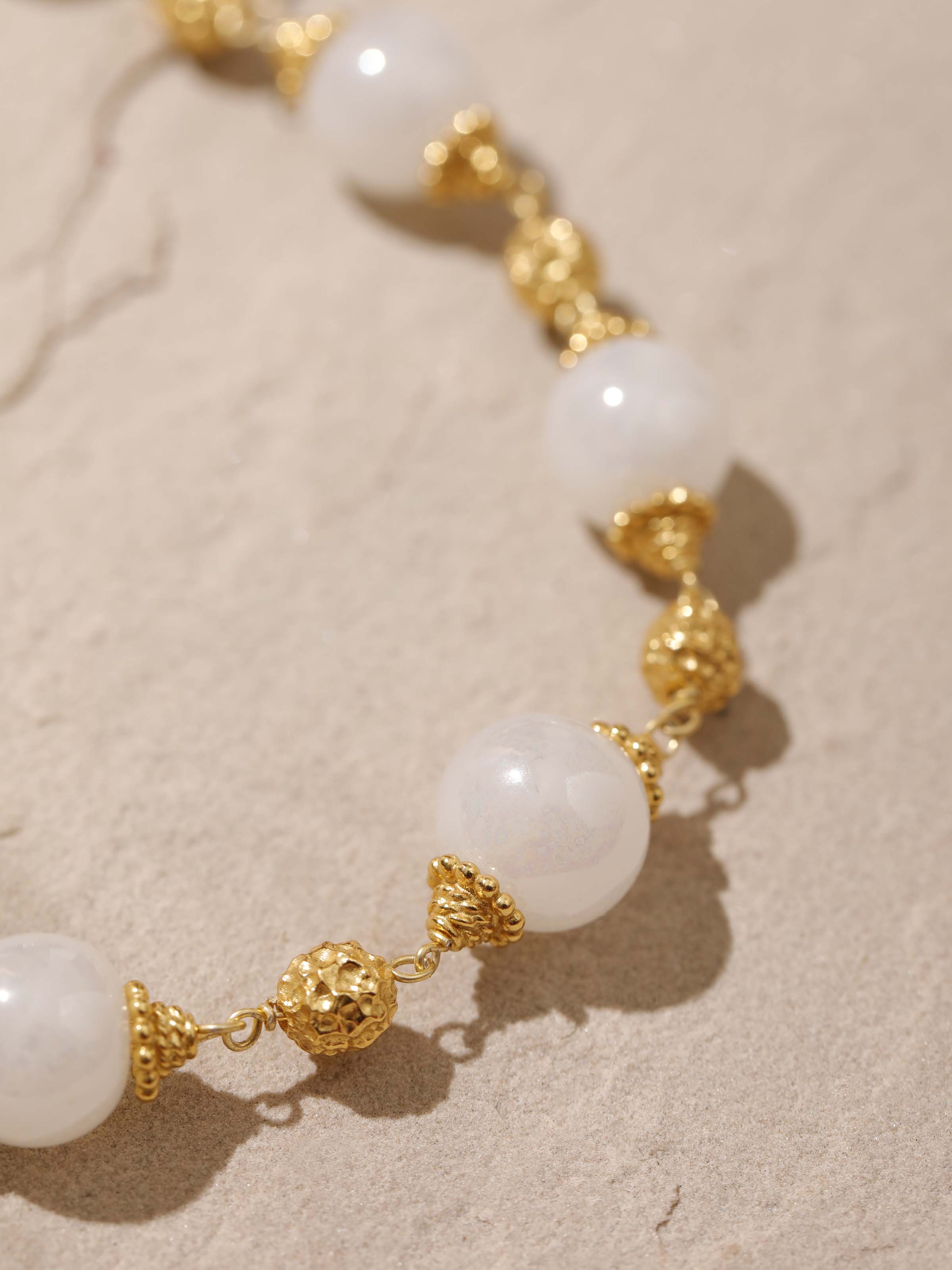 Silver Smithing Drop Earrings in natural light showcasing their refined details.