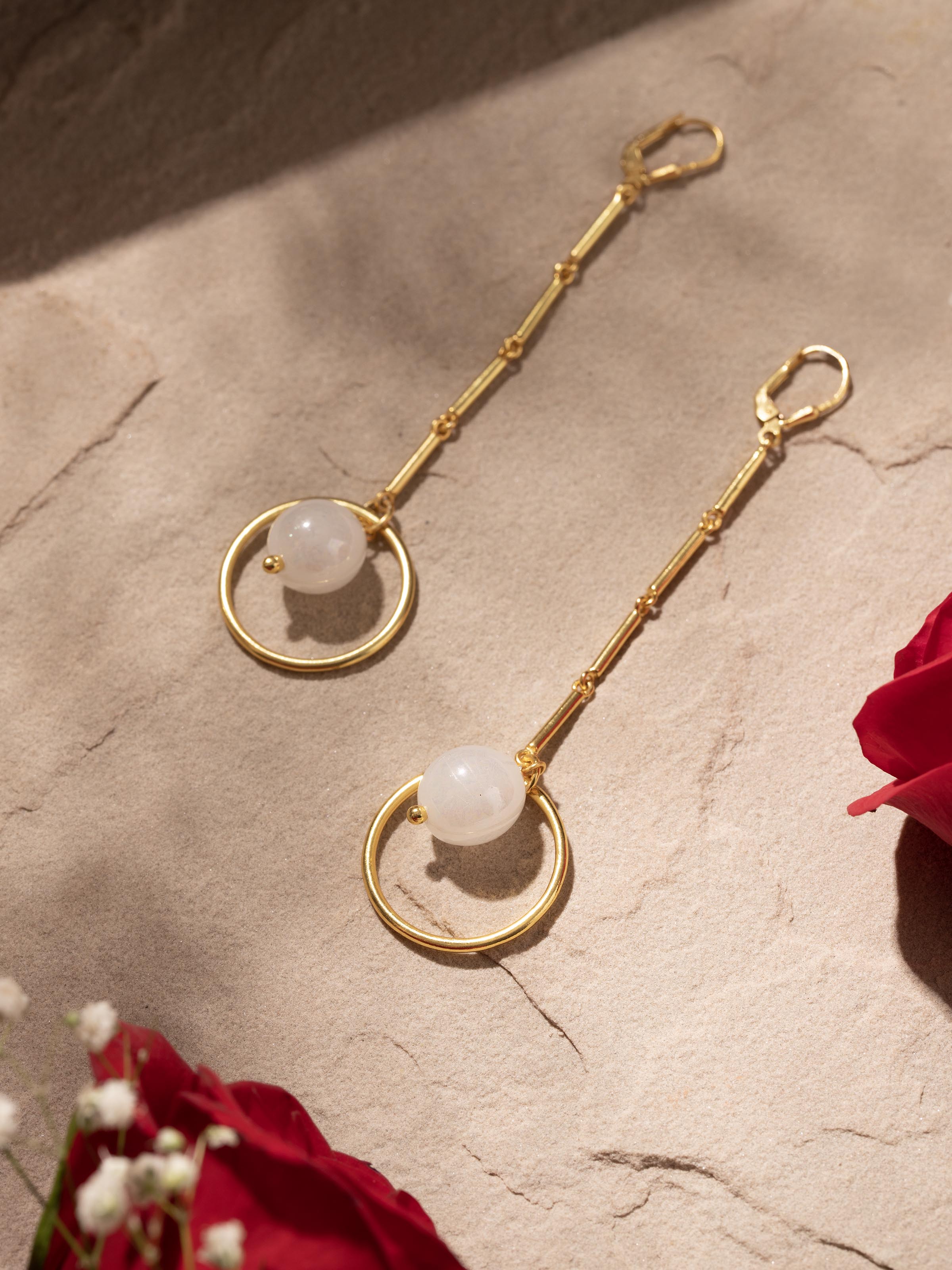 Side view of Silver Flame Glass Drop Earrings emphasizing drop design and vibrant glass colors.