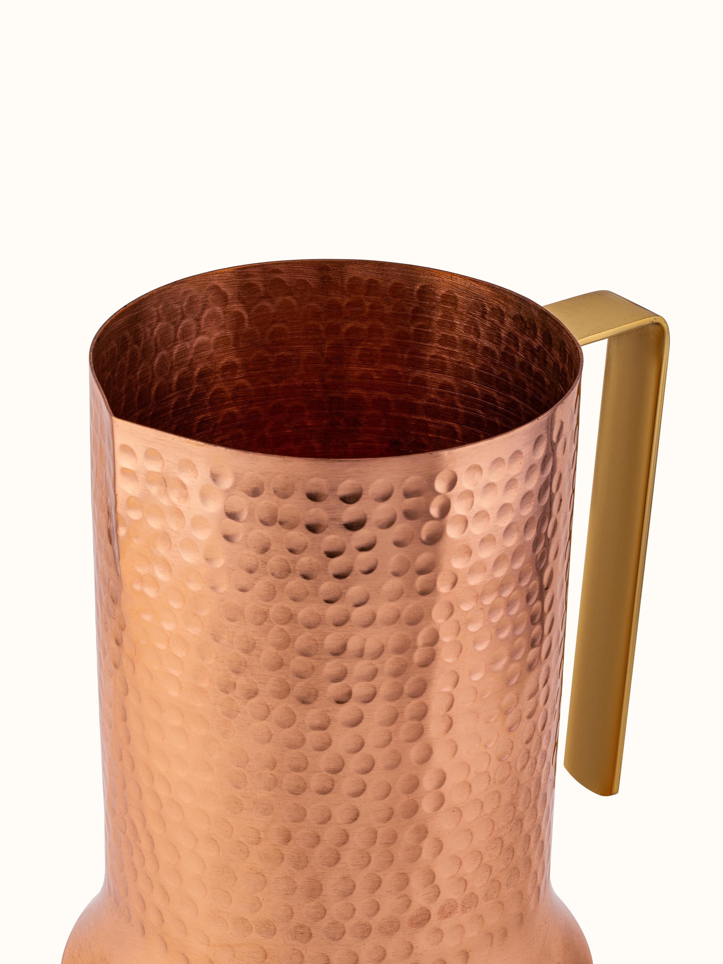 Detailed view of Copper Metal Jug focusing on the base and intricate design elements.