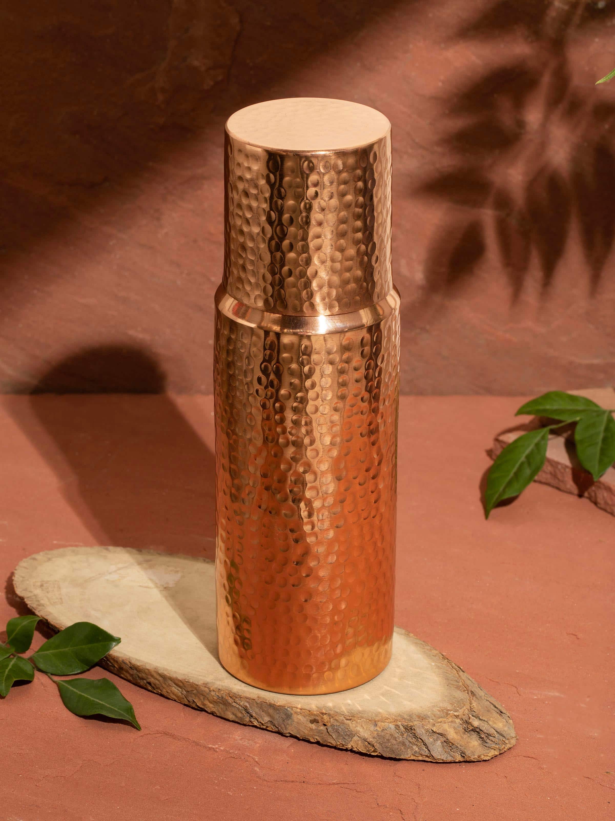 Side view of Copper Metal Carafe highlighting the intricate lid and spout design