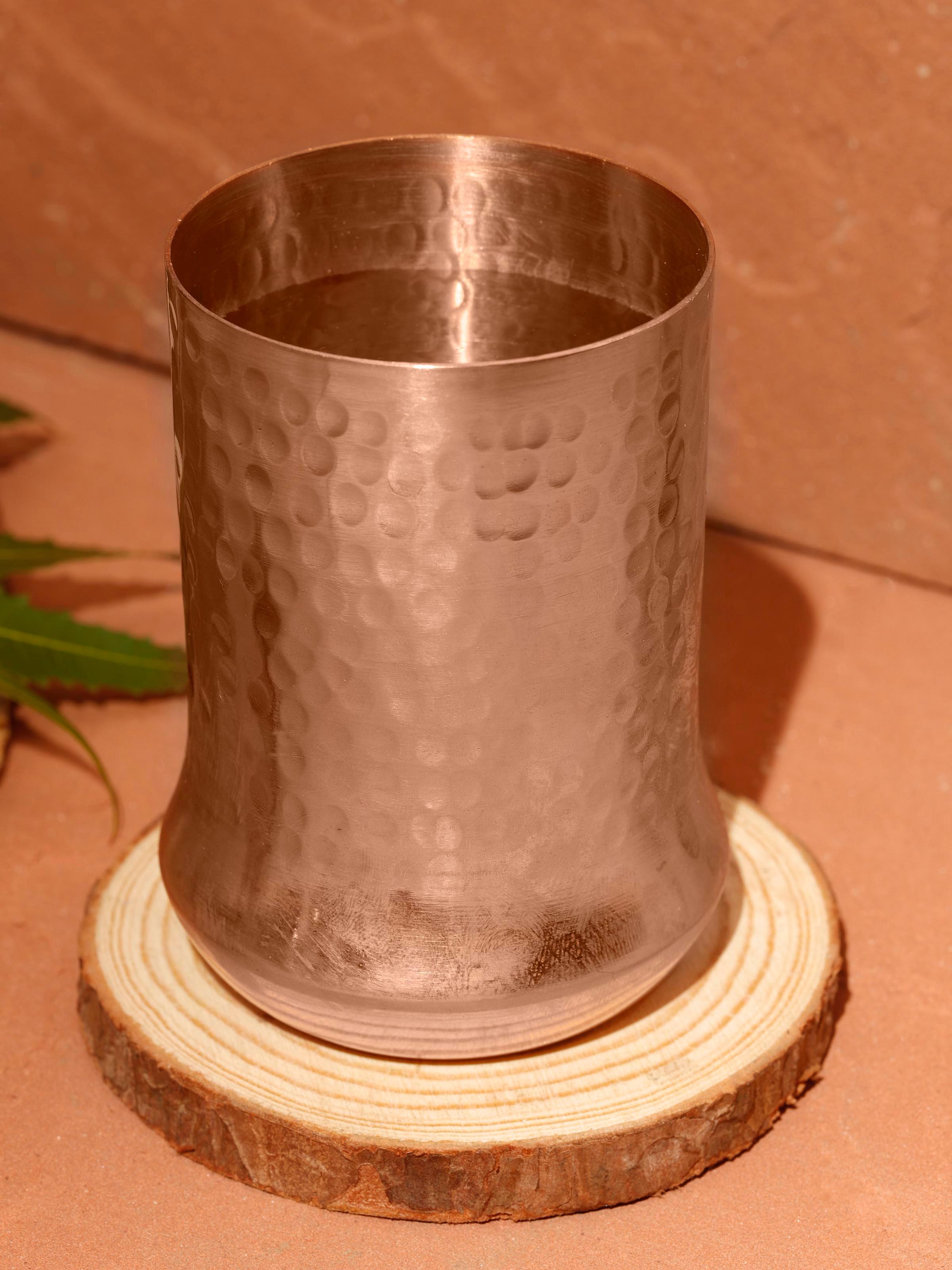 Close-up of intricate detailing on copper metal glass, highlighting its craftsmanship and texture.
