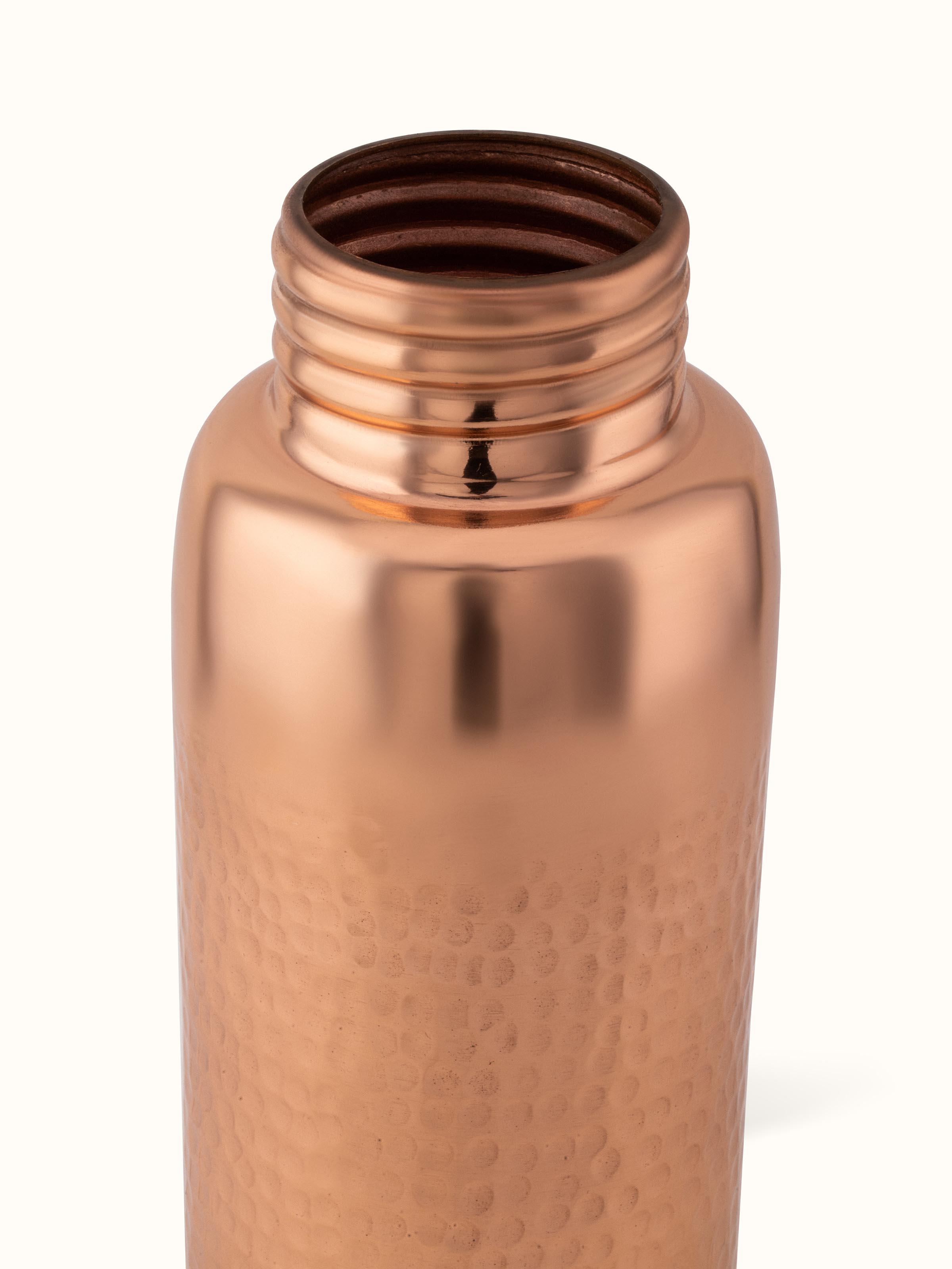 Top view of Copper Metal Hammered Bottle displaying the bottle opening and textured lid.