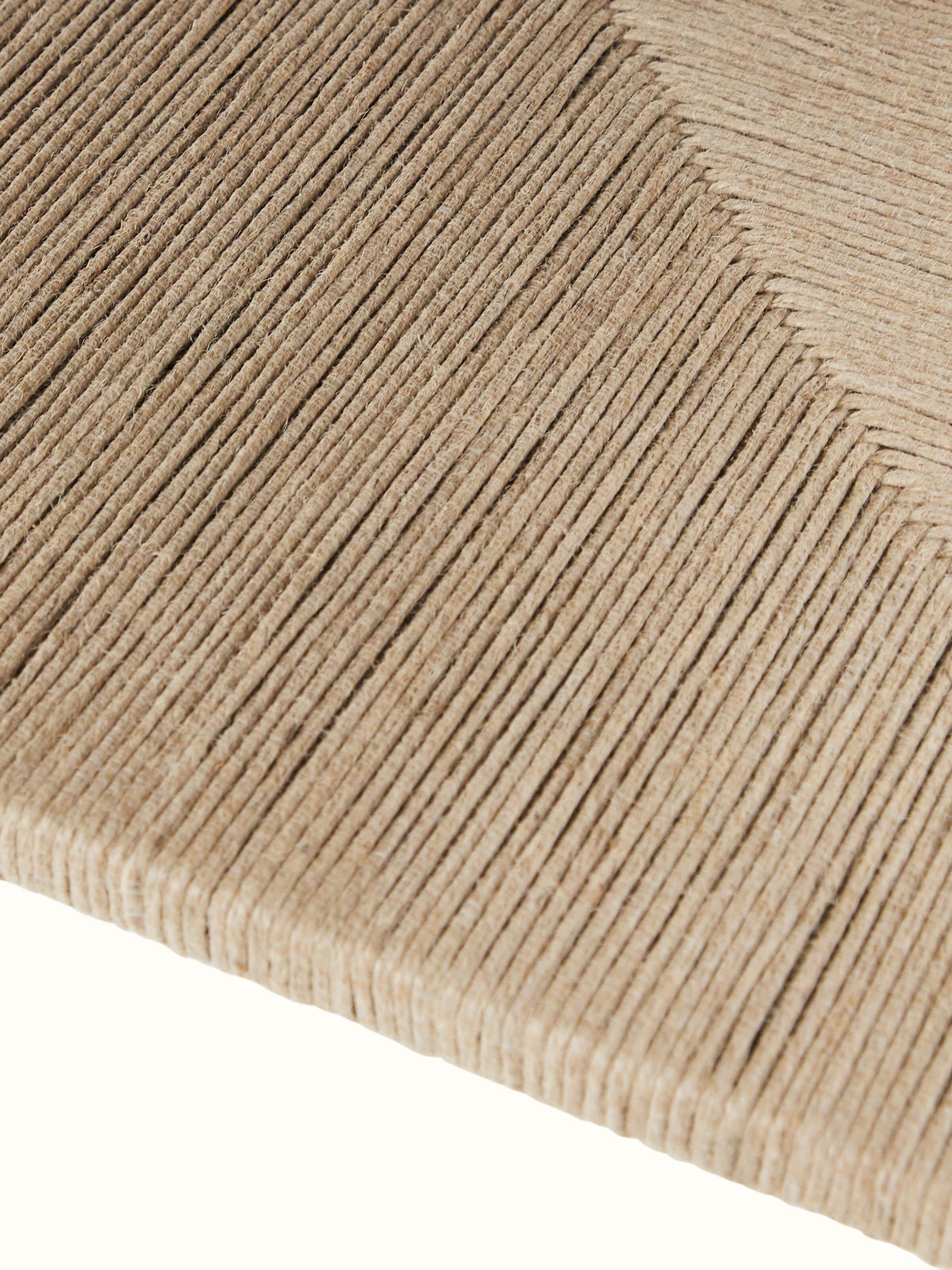 Close-up view of Jute & Marble coffee table focusing on the polished marble top and the intricate jute detailing on the base.