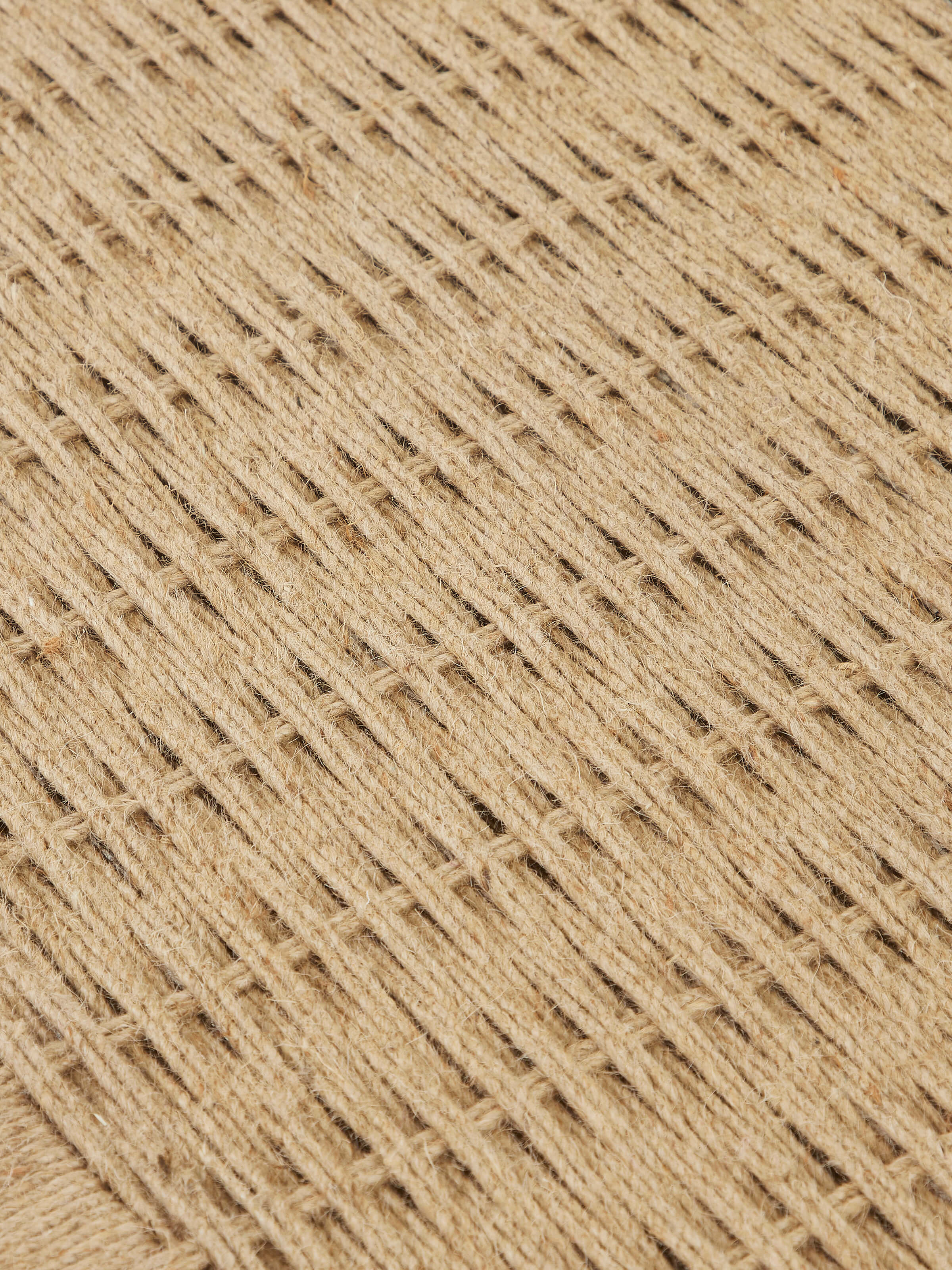 Detailed side view of Jute & Mango Wood Daybed by Swadesh showcasing intricate weaving and polished wooden finish.