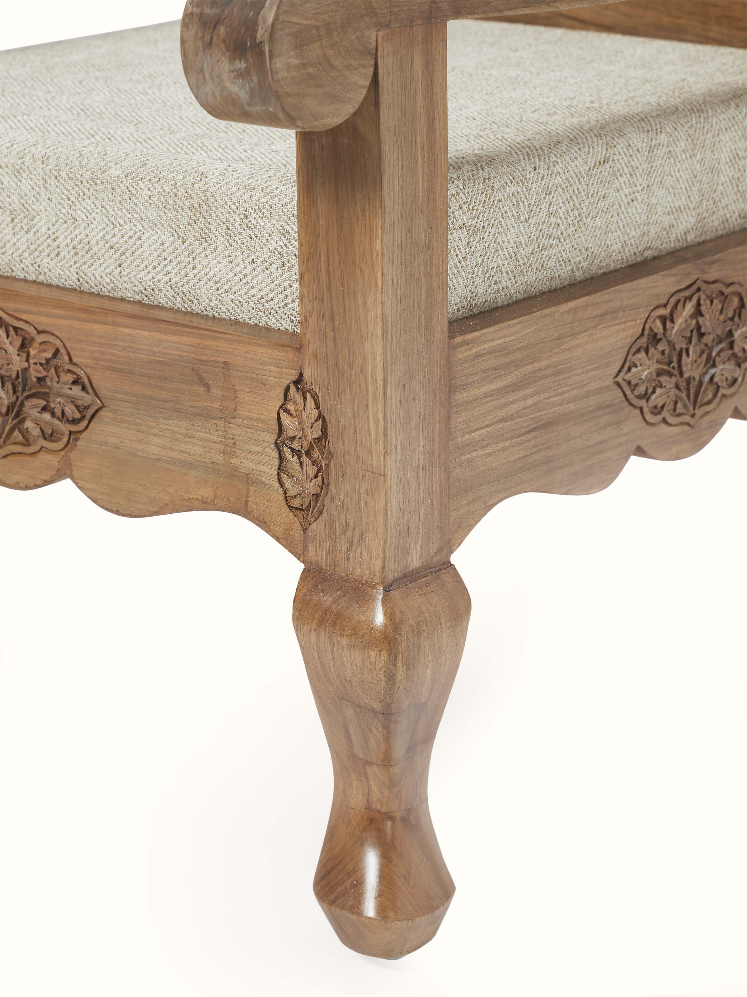 Back view of the handloom fabric upholstered carved walnut wood armchair, showing the full design and craftsmanship of the chair