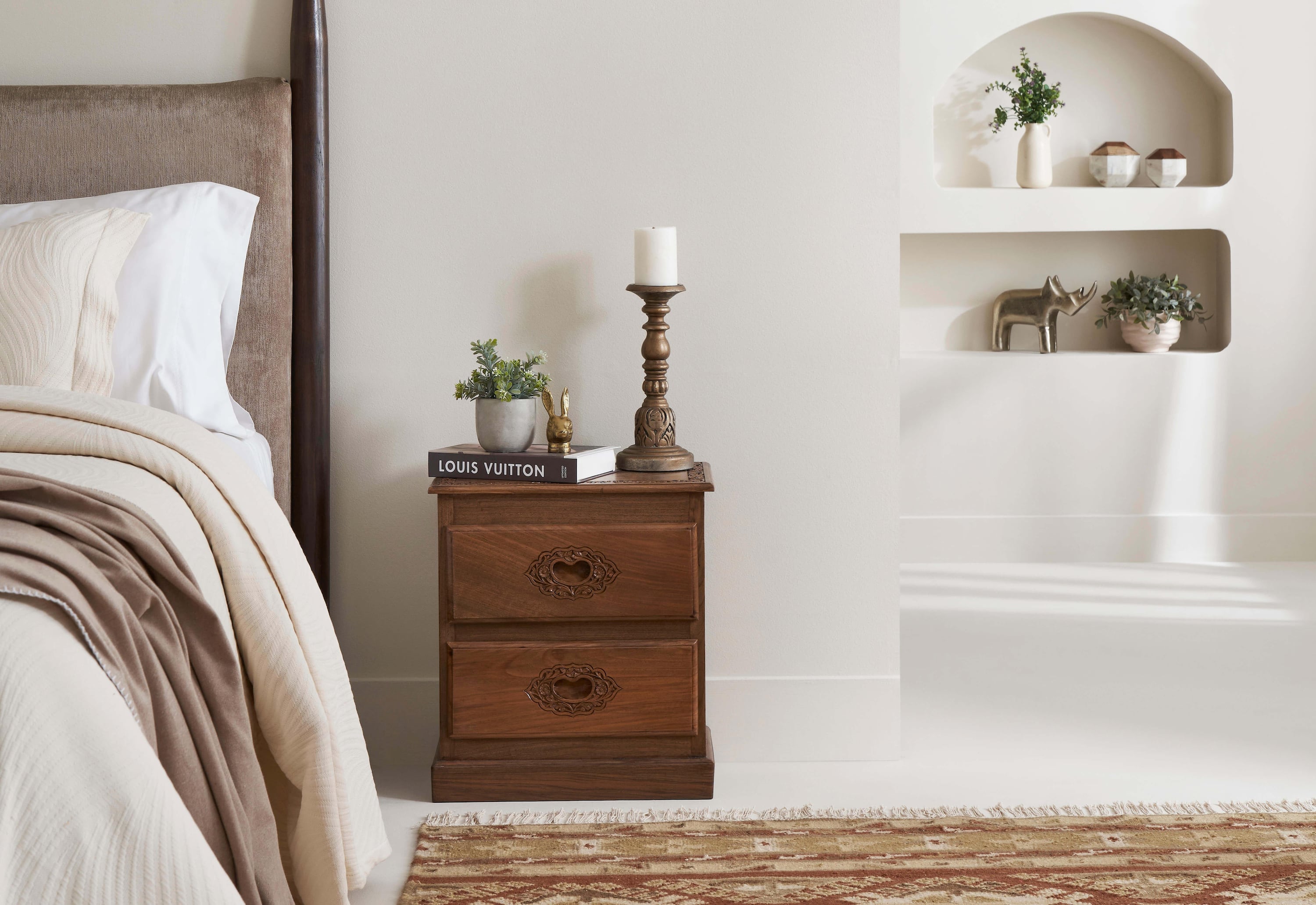 Side view of the carved walnut wood bedside table, showcasing the elegant design and craftsmanship