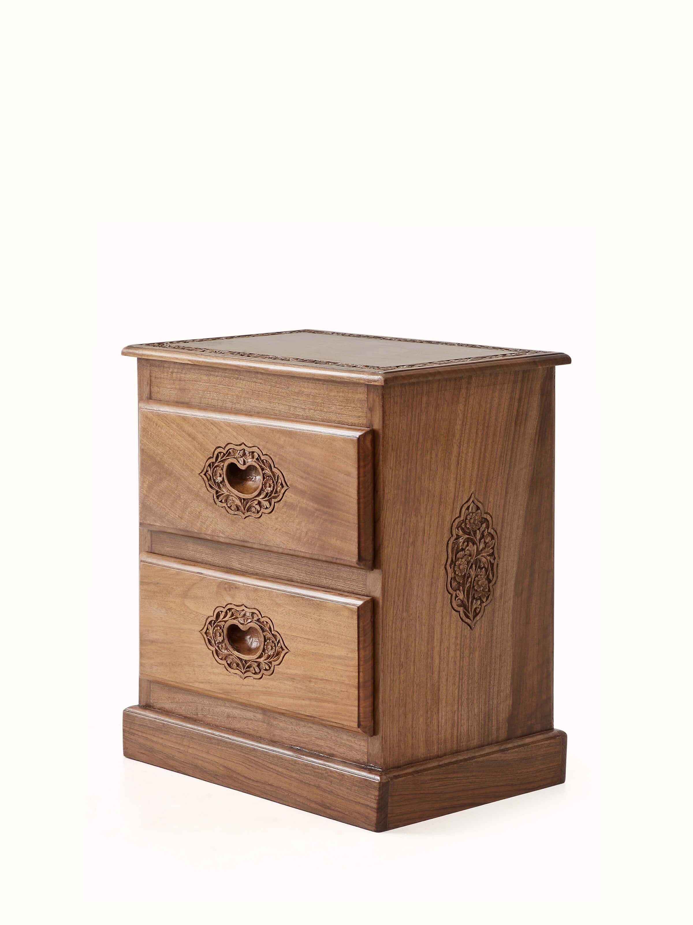 Close-up of the carved details on the walnut wood bedside table, emphasizing the intricate patterns and textures