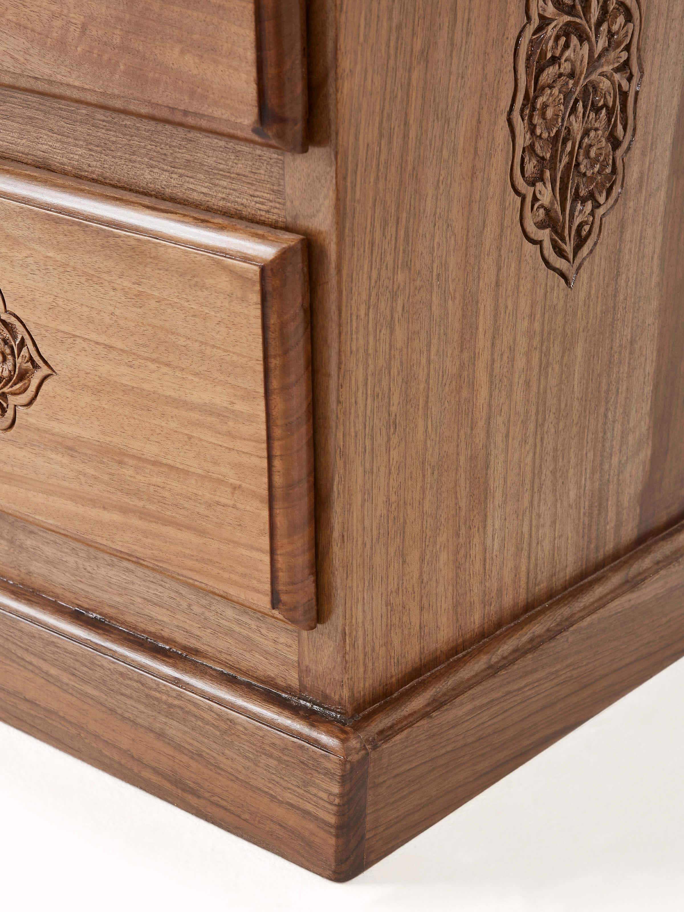 Top view of the carved walnut wood bedside table, highlighting the tabletop and carved details