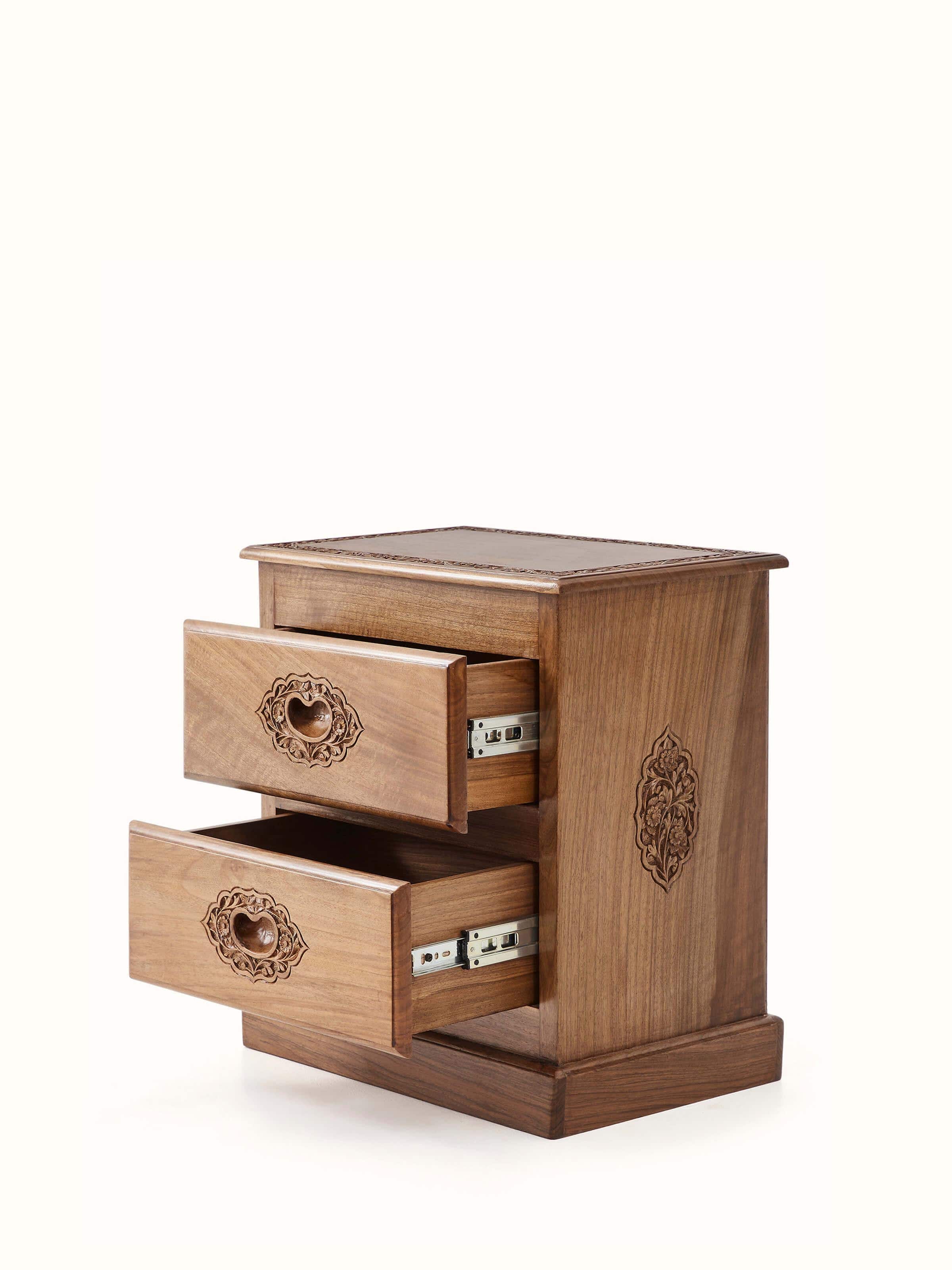 Close-up view of the walnut wood finish and carving on the bedside table, emphasizing the intricate details and craftsmanship