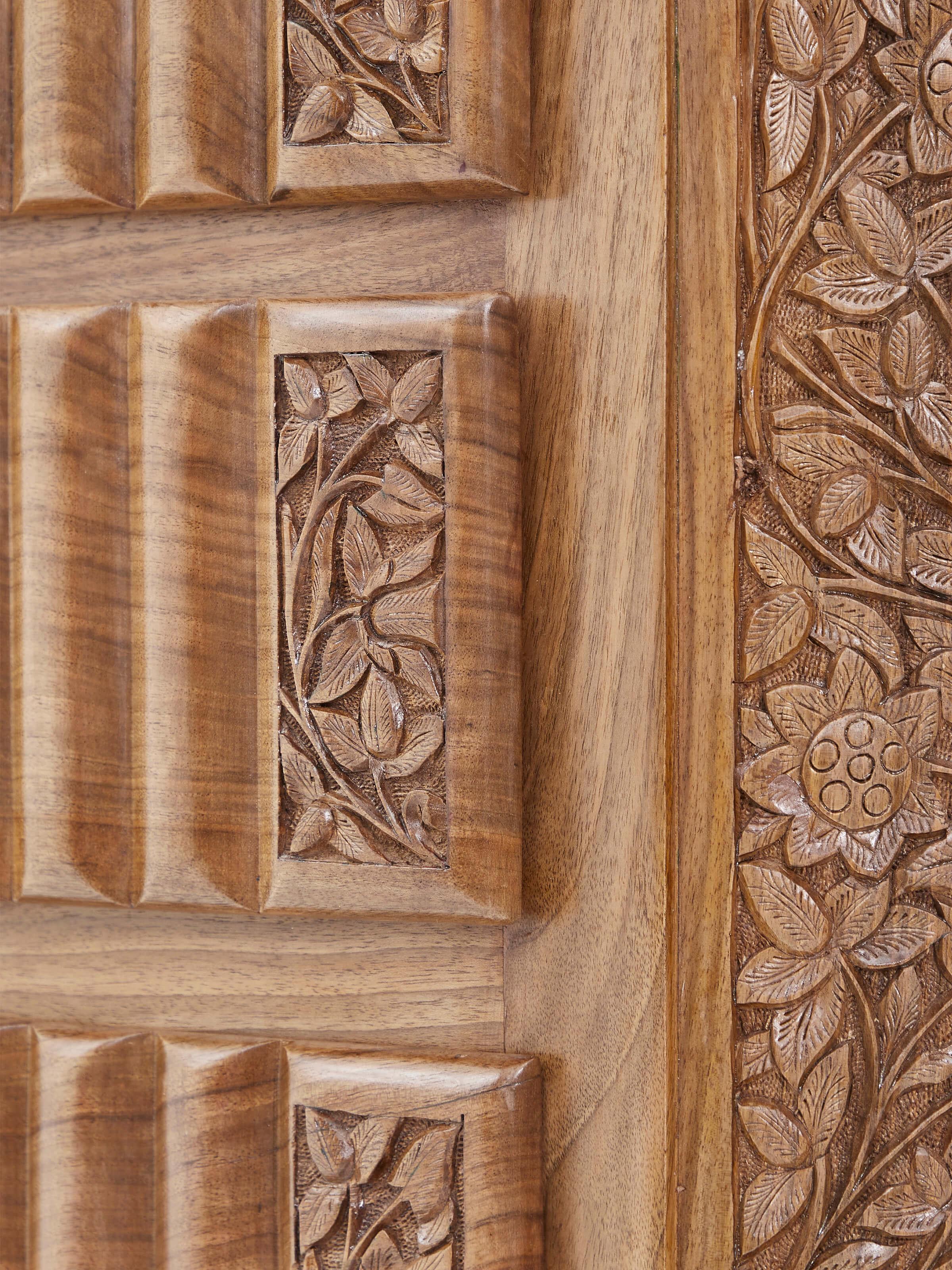 Drawer open view of carved walnut drawer chest, displaying ample storage space