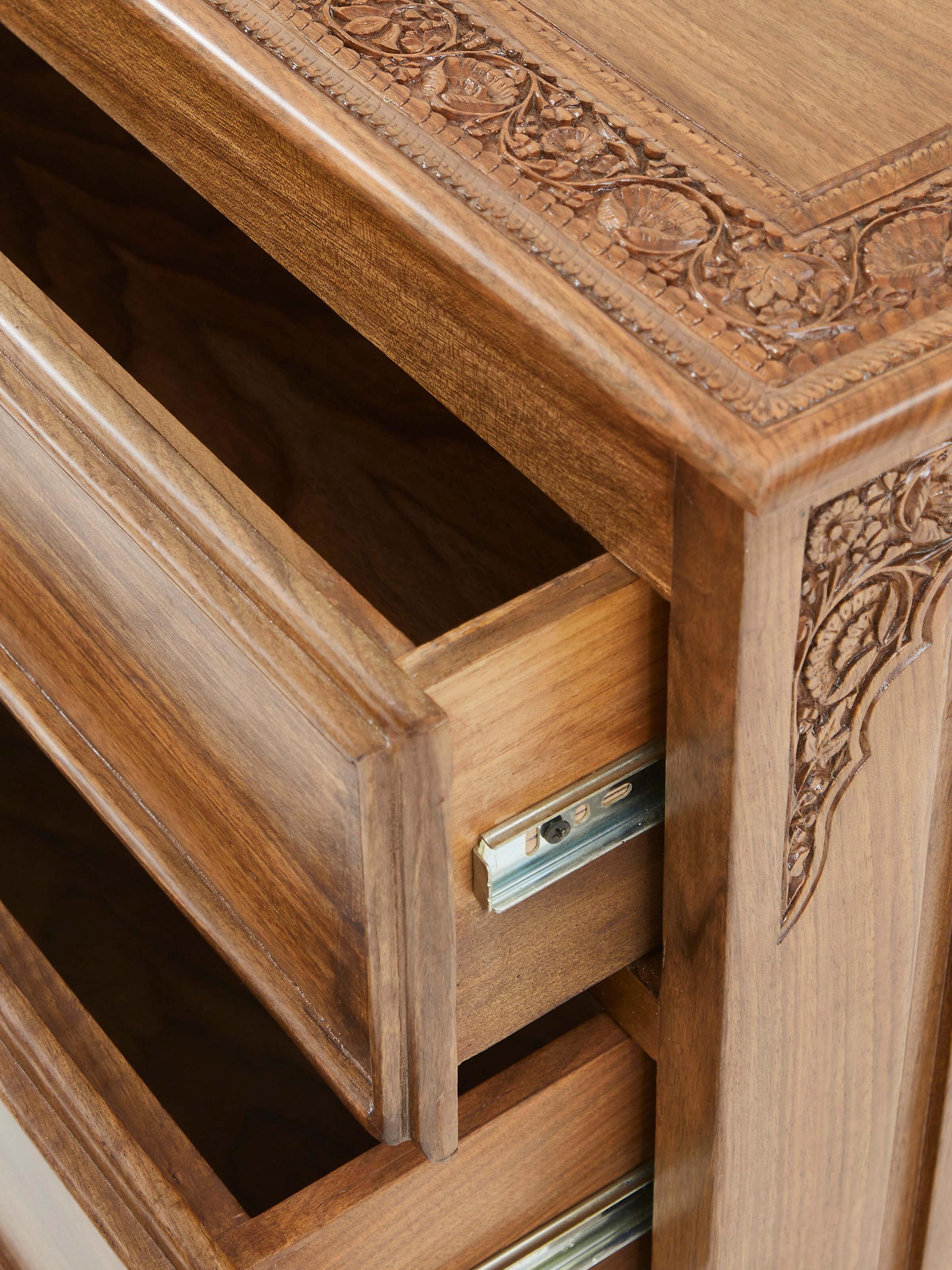 Close-up of the carving details and finish on Carved Walnut Wood Drawer Chest