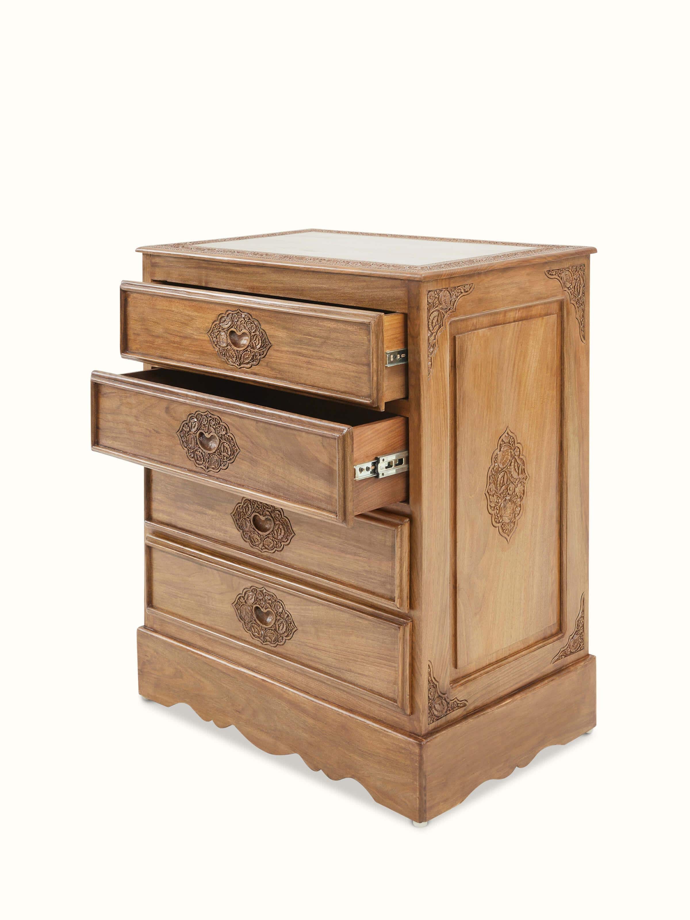 View of the carved patterns and drawer handles on Carved Walnut Wood Drawer Chest