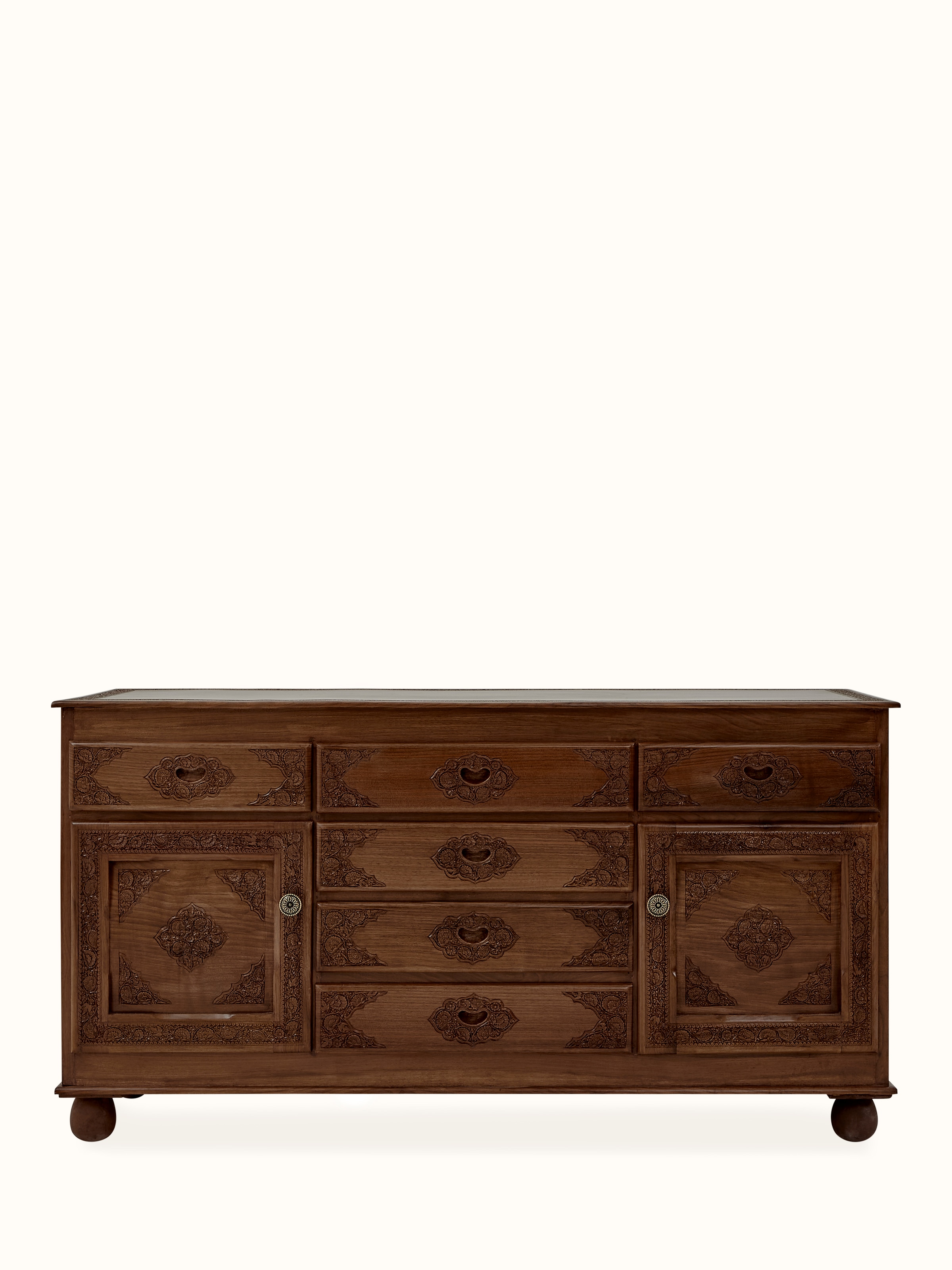 Front view of natural finish carved walnut wood sideboard with five drawers, showcasing its elegant design and detailed carvings.