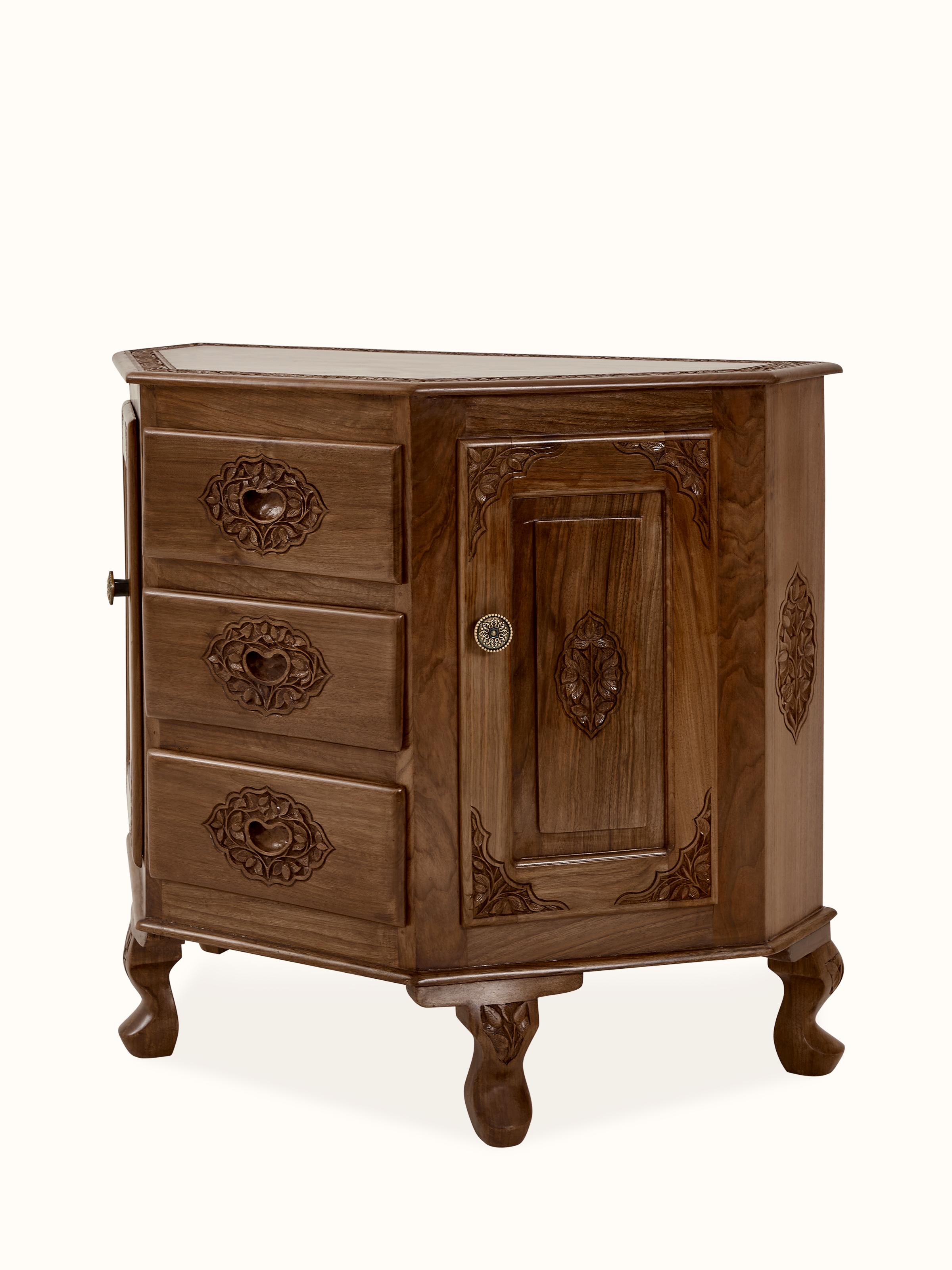 Close-up of the carved detailing on the walnut wood sideboard, emphasizing intricate patterns and craftsmanship