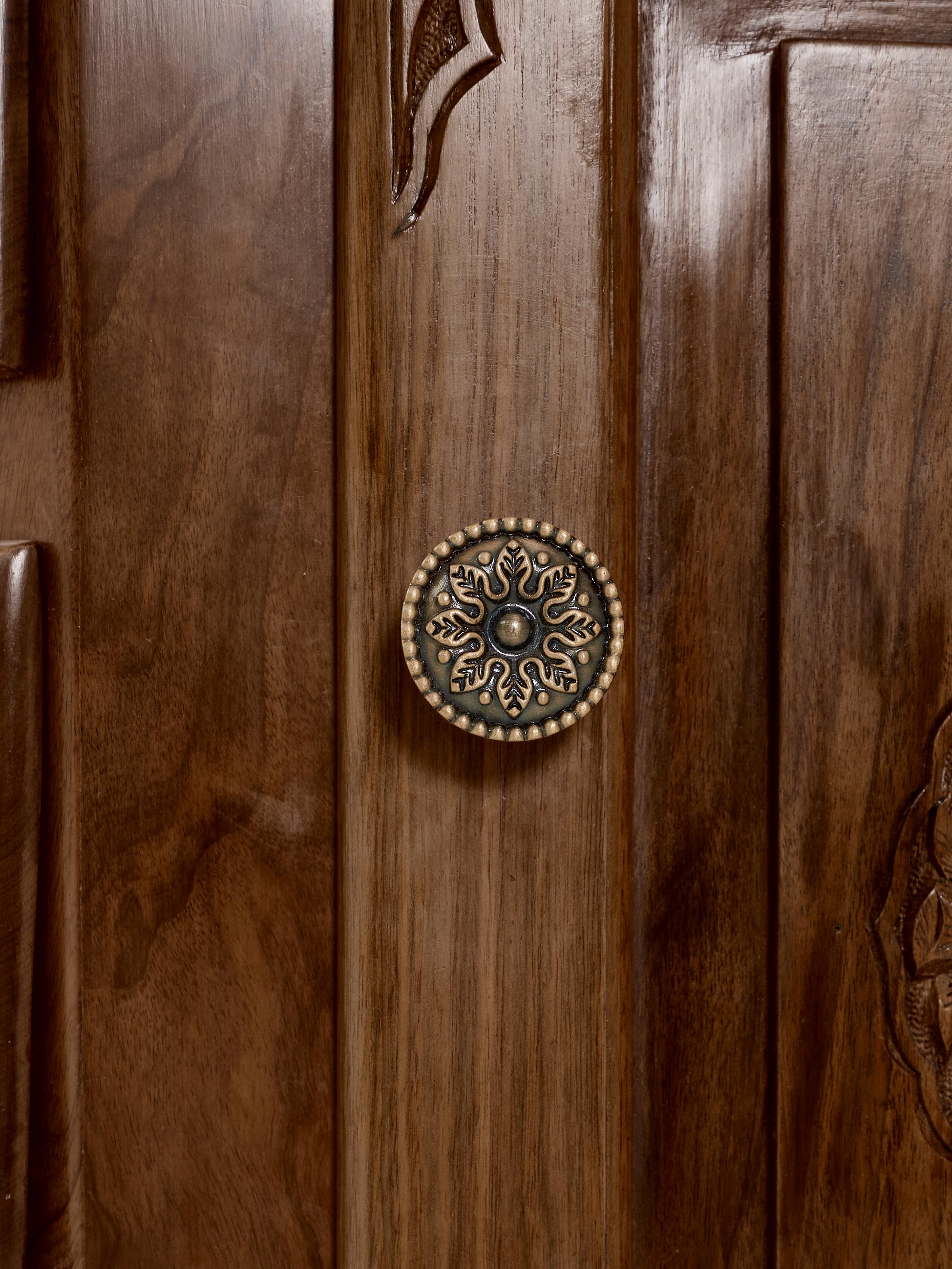 Side angle view of the walnut wood sideboard, highlighting its drawers and natural finish