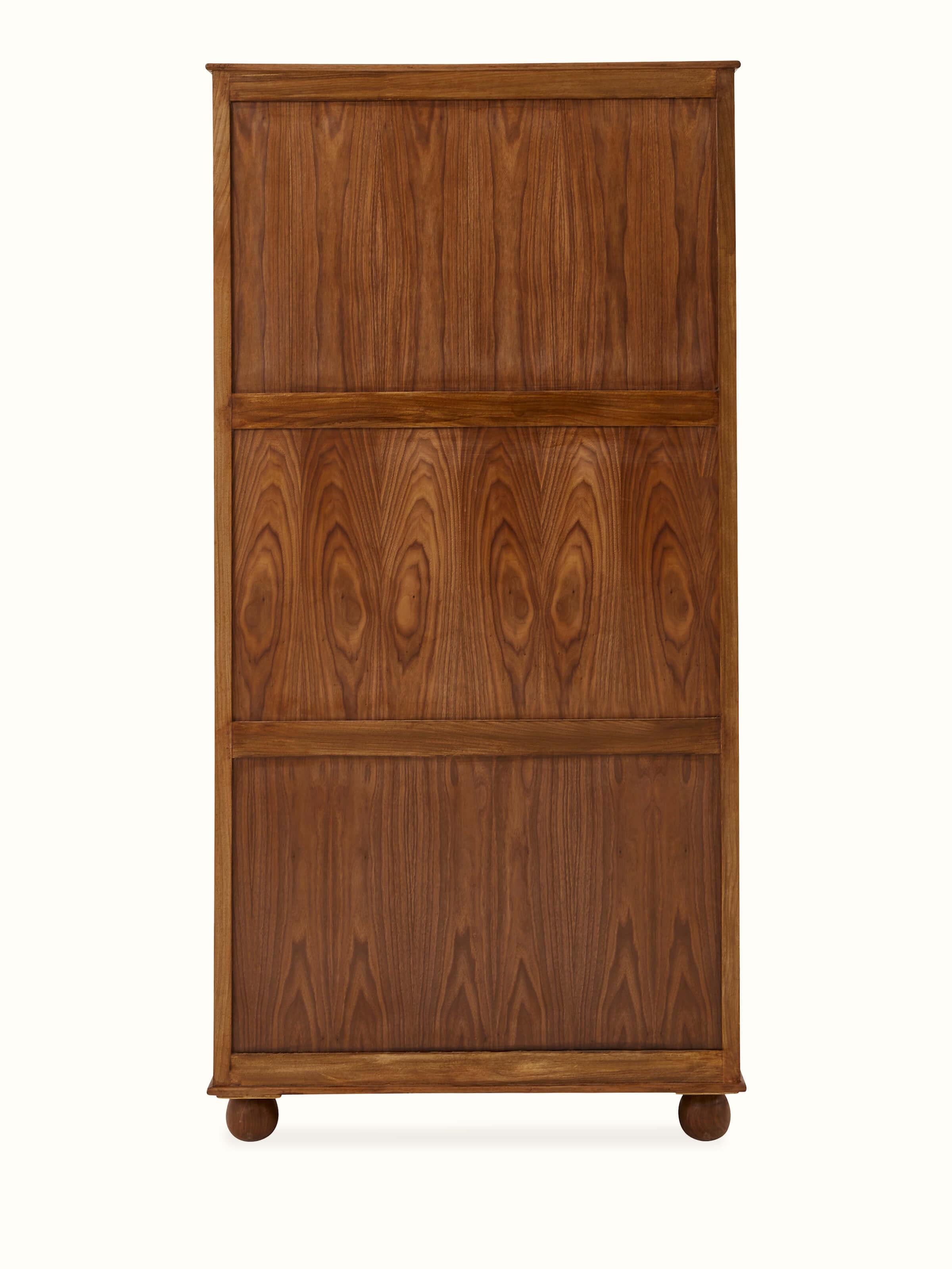 Side view of carved walnut wood wardrobe, highlighting the smooth finish and elegant design