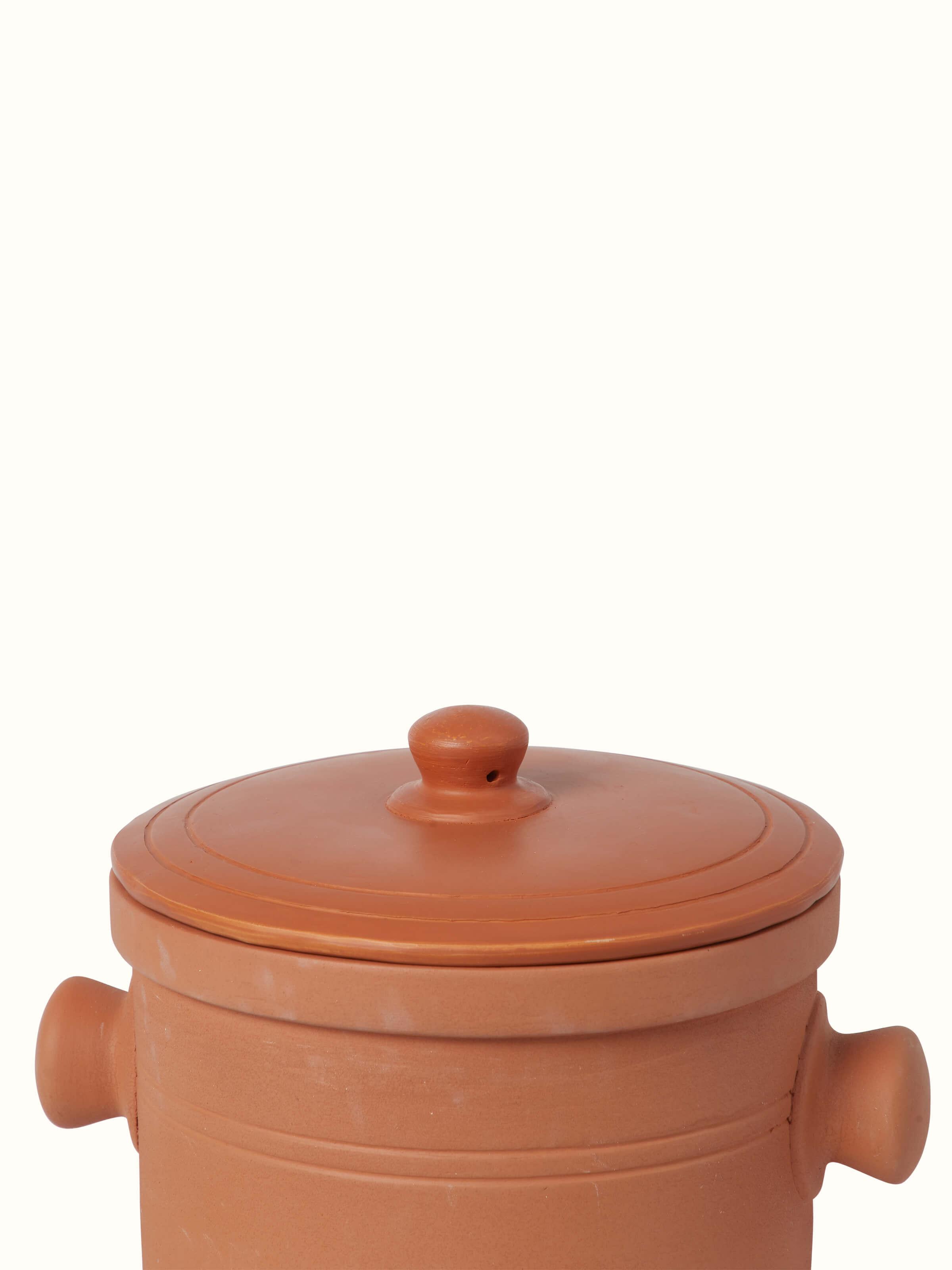 Detailed view of terracotta clay cooking pot, showcasing its unique design