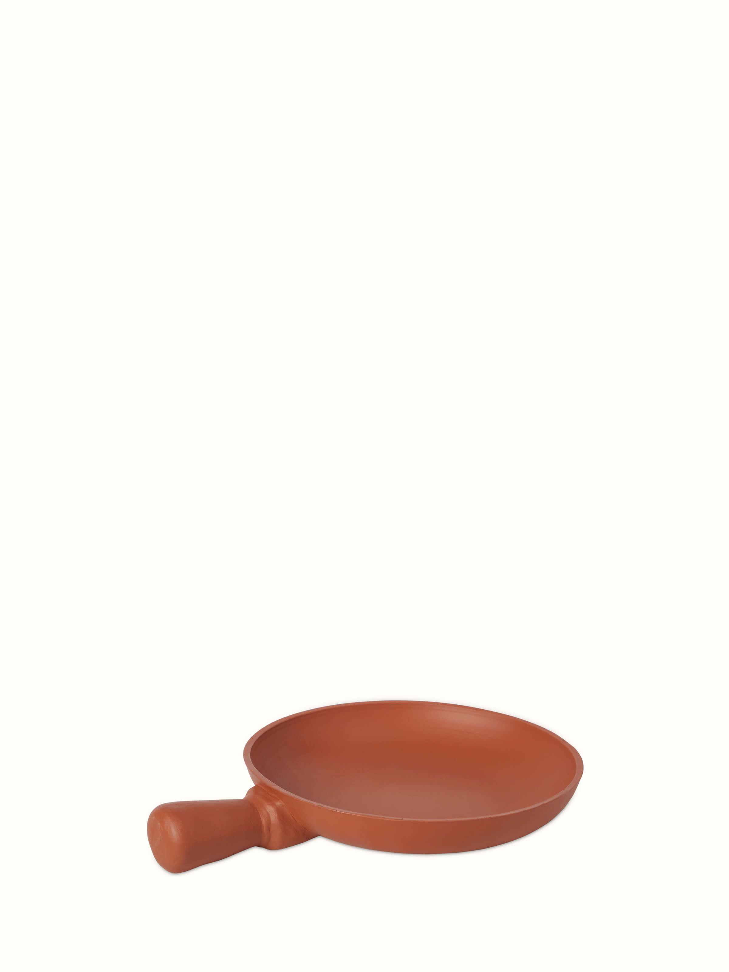 Front view of terracotta clay pan with a rustic finish, highlighting its traditional design.