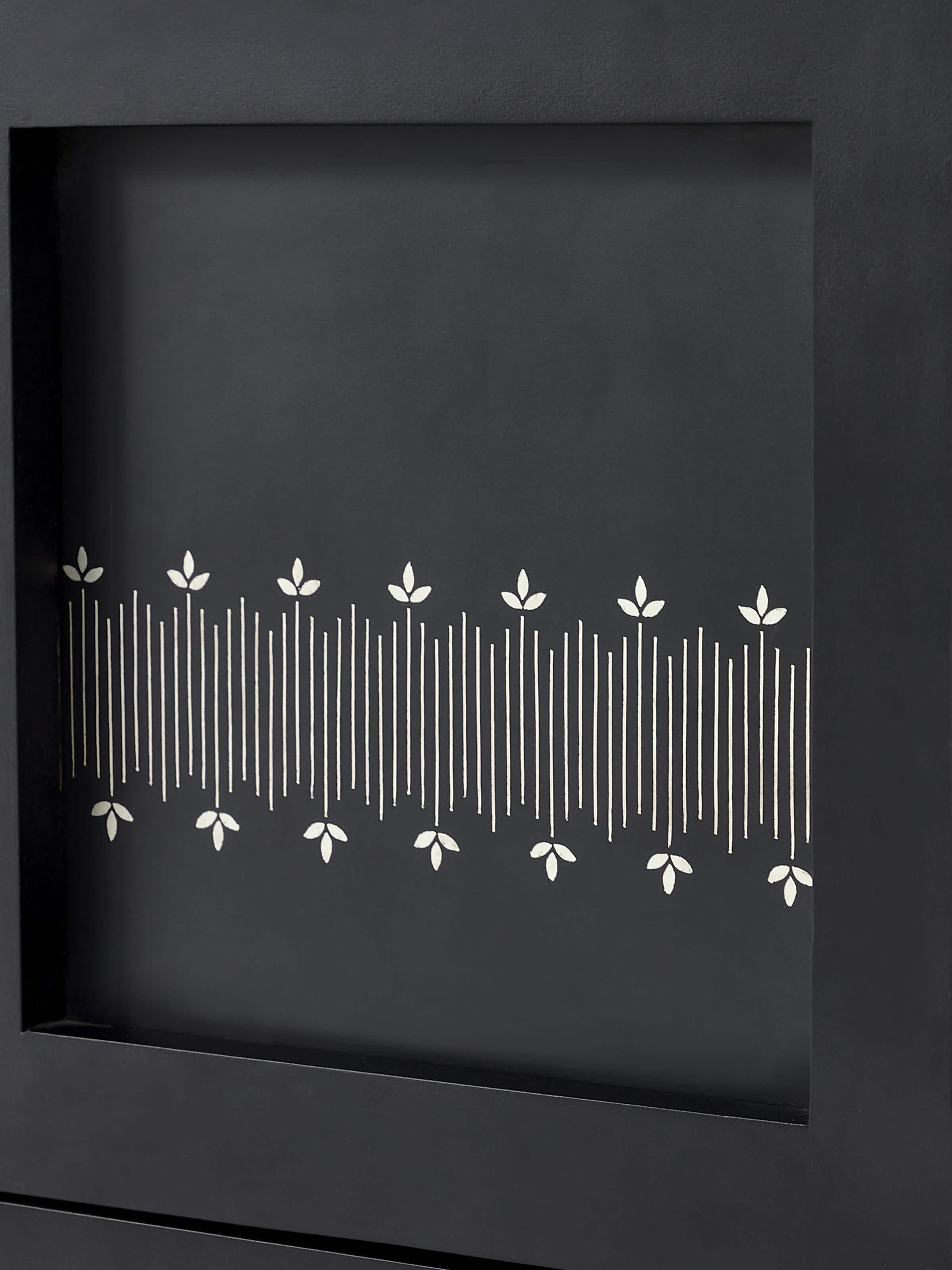 Detailed view of the metal and Bidriware inlay on the mango wood bookshelf