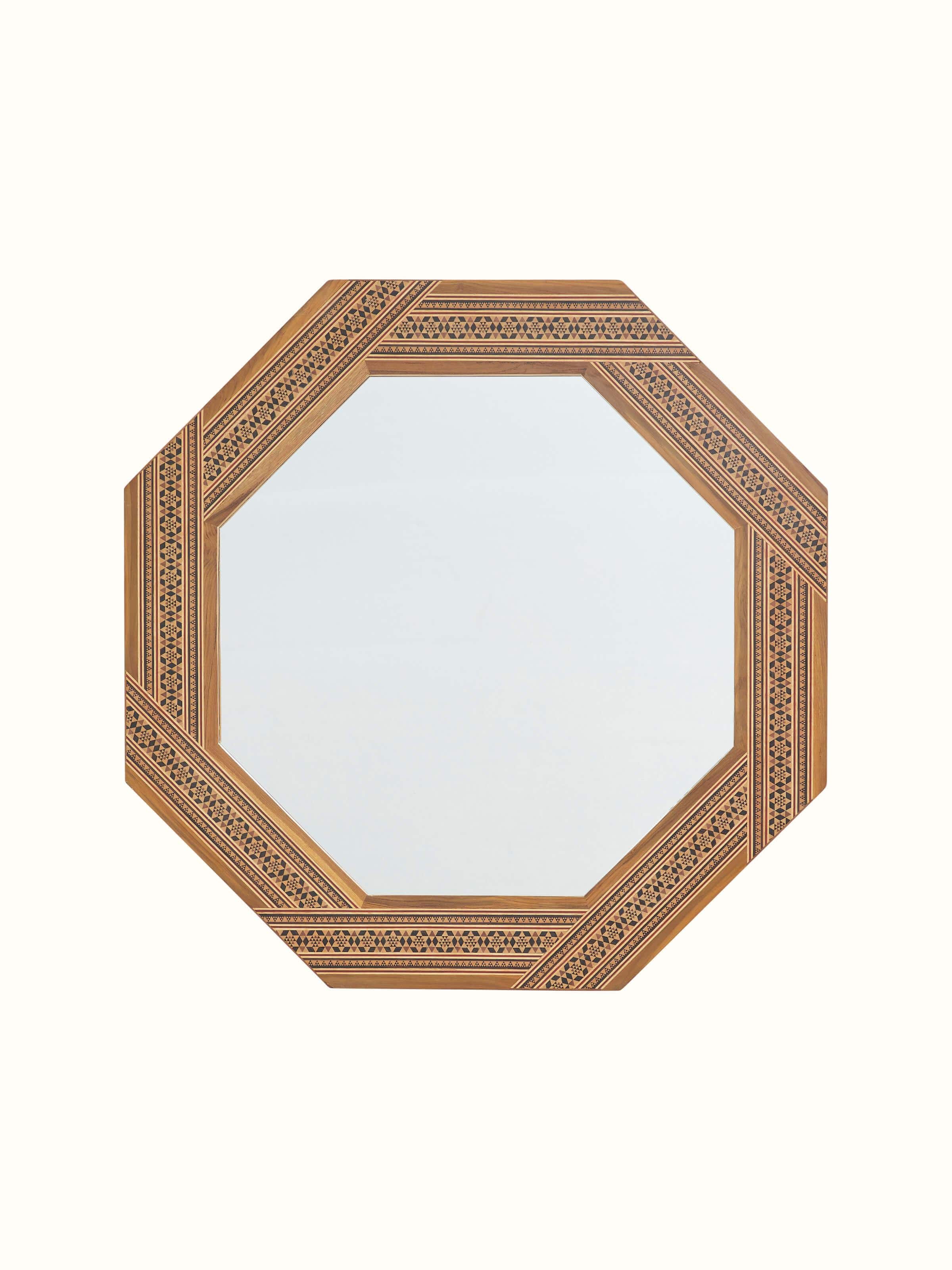 Front view of the teak wood marquetry octagonal wall mirror, showcasing intricate woodwork and mirror frame details.