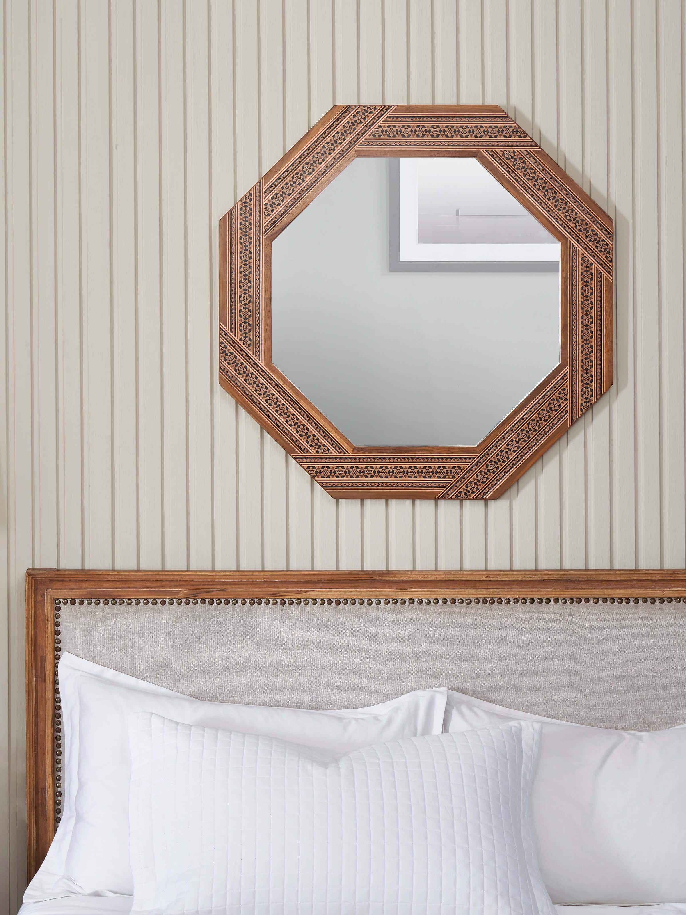 Side view of the teak wood marquetry octagonal wall mirror, highlighting the mirror's depth and frame craftsmanship.