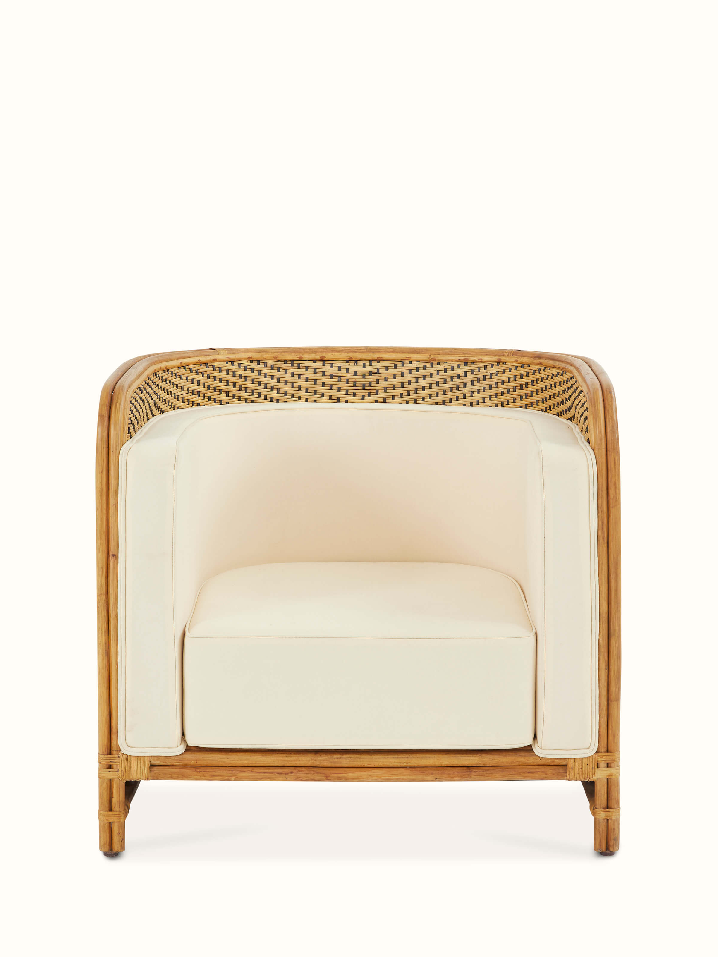 Front view of Upholstered Cane Armchair highlighting its elegant upholstery and cane details