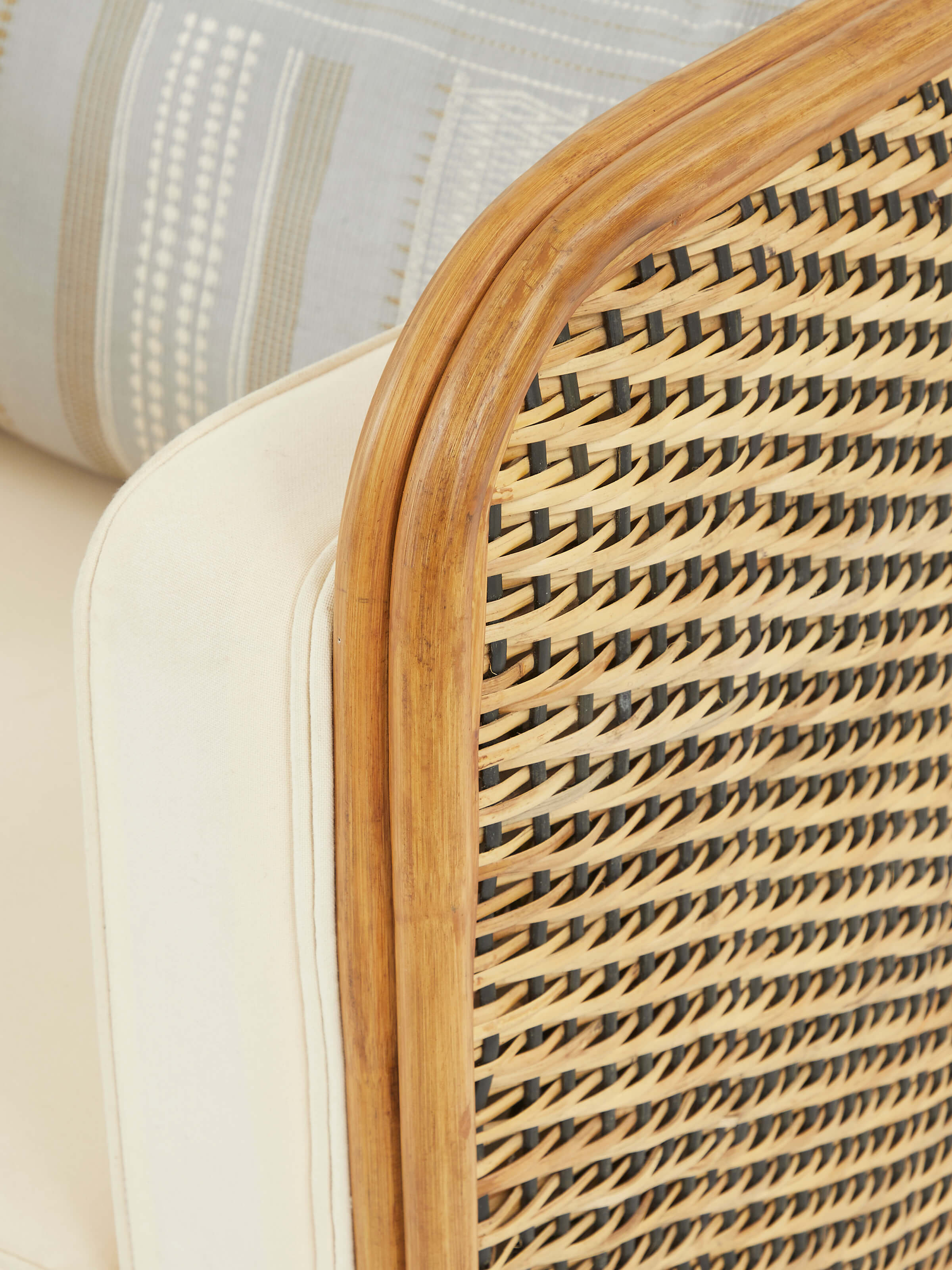 Top view of Upholstered Cane Armchair revealing the seat and armrest upholstery