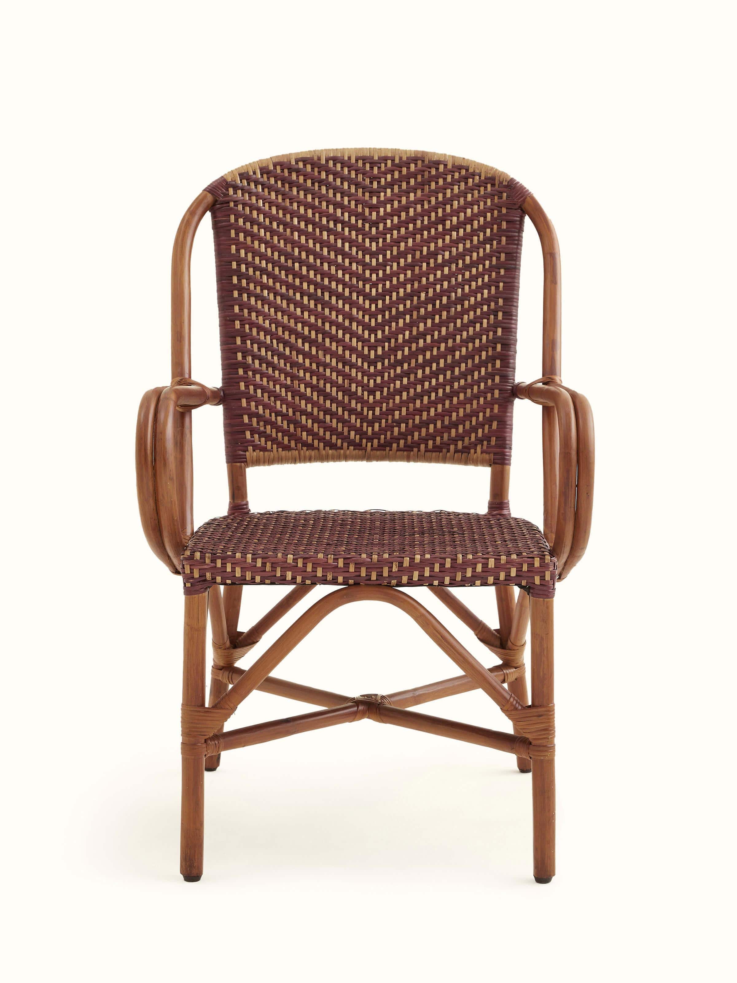 Front view of the cane patio chair, showcasing its elegant and durable design