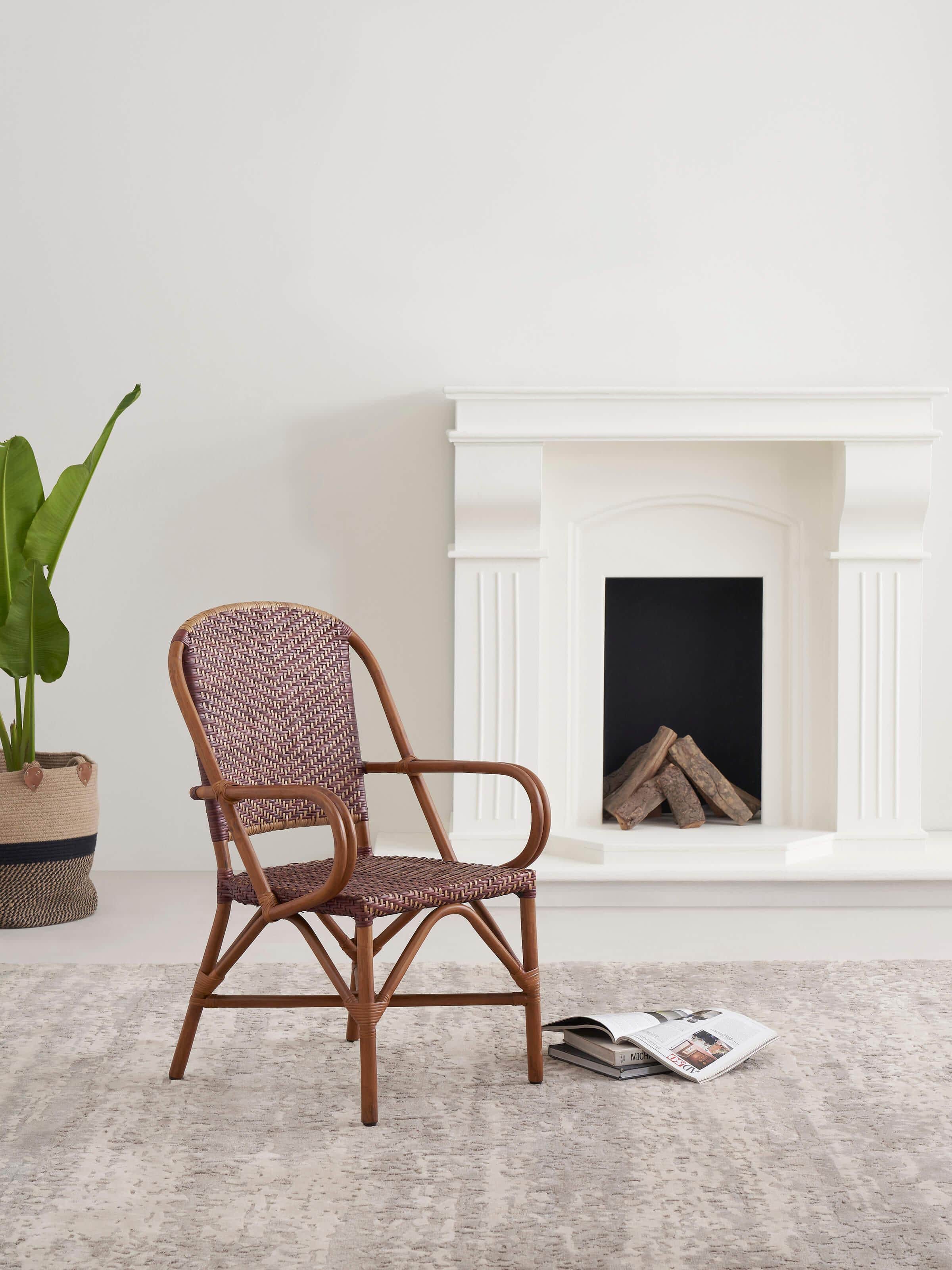 Side view of the cane patio chair, highlighting the intricate cane weaving and sturdy frame