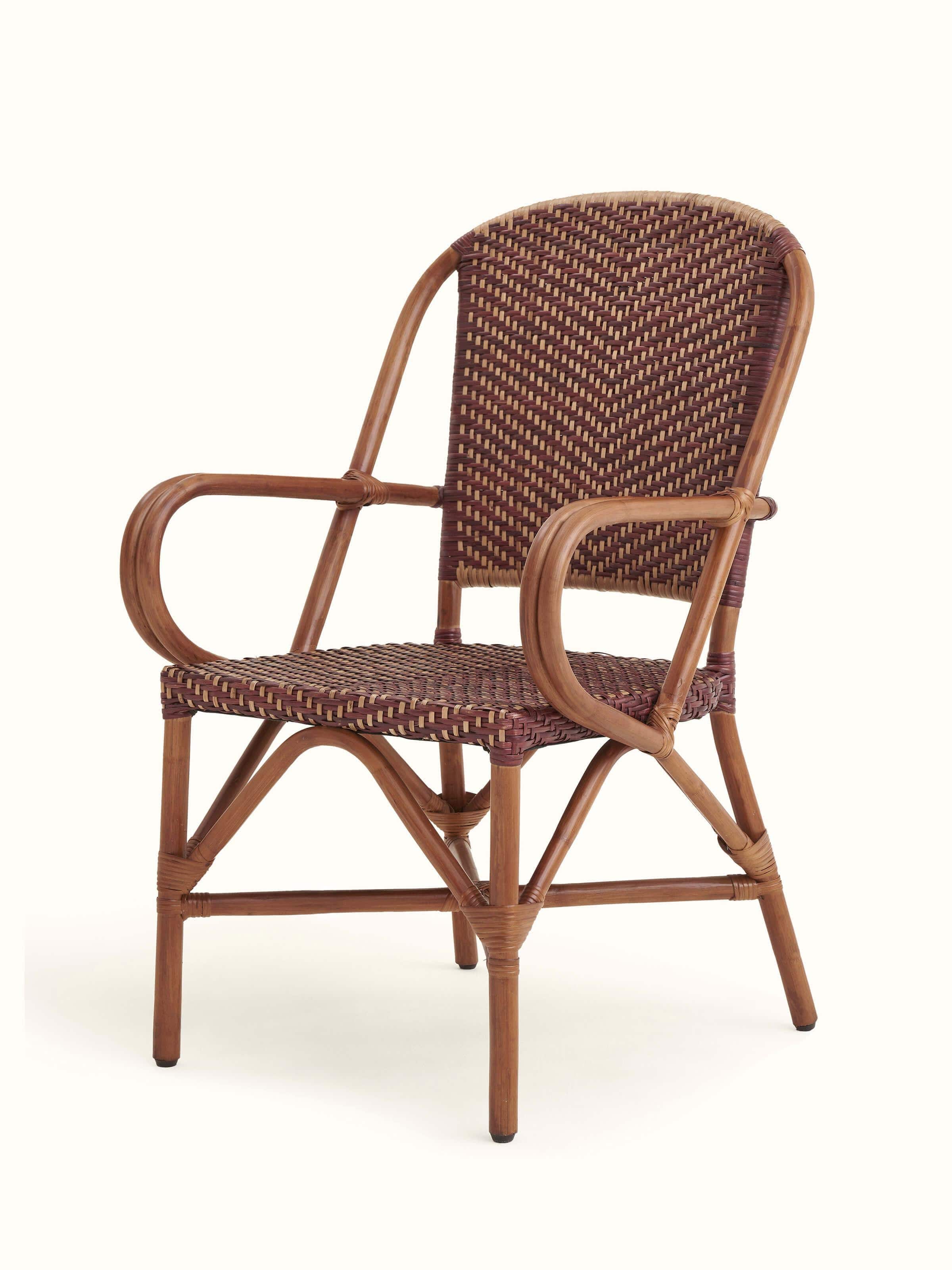 Close-up of the cane work on the patio chair, showing the detailed weaving and craftsmanship